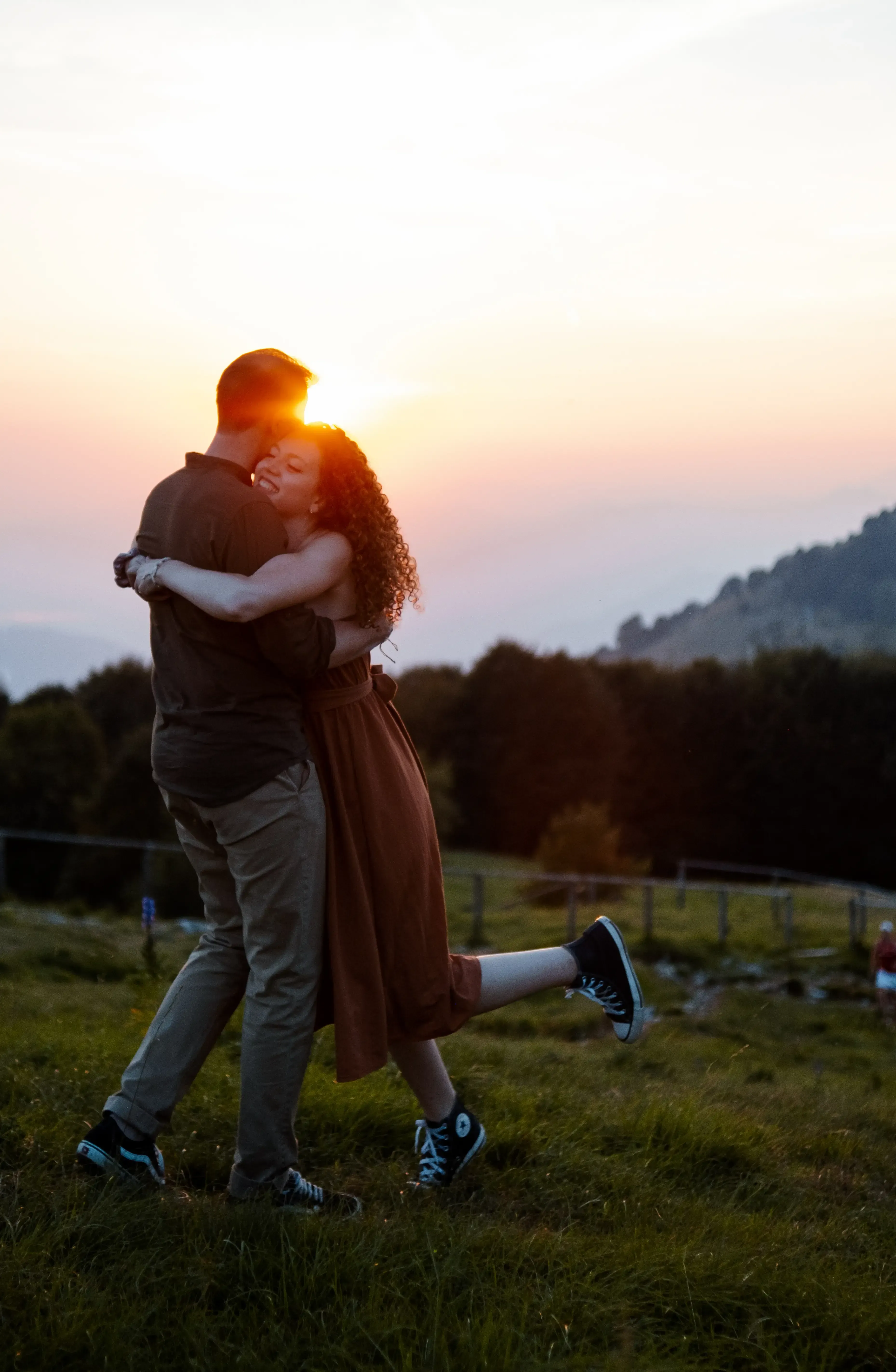 Greta embracing Nicolò tightly after running towards him.