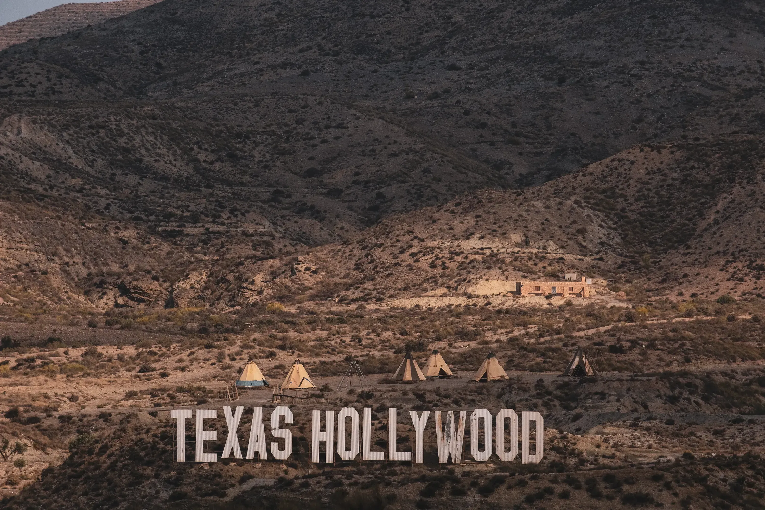 The large 'Texas Hollywood' sign marking the entrance to the Fort Bravo set.