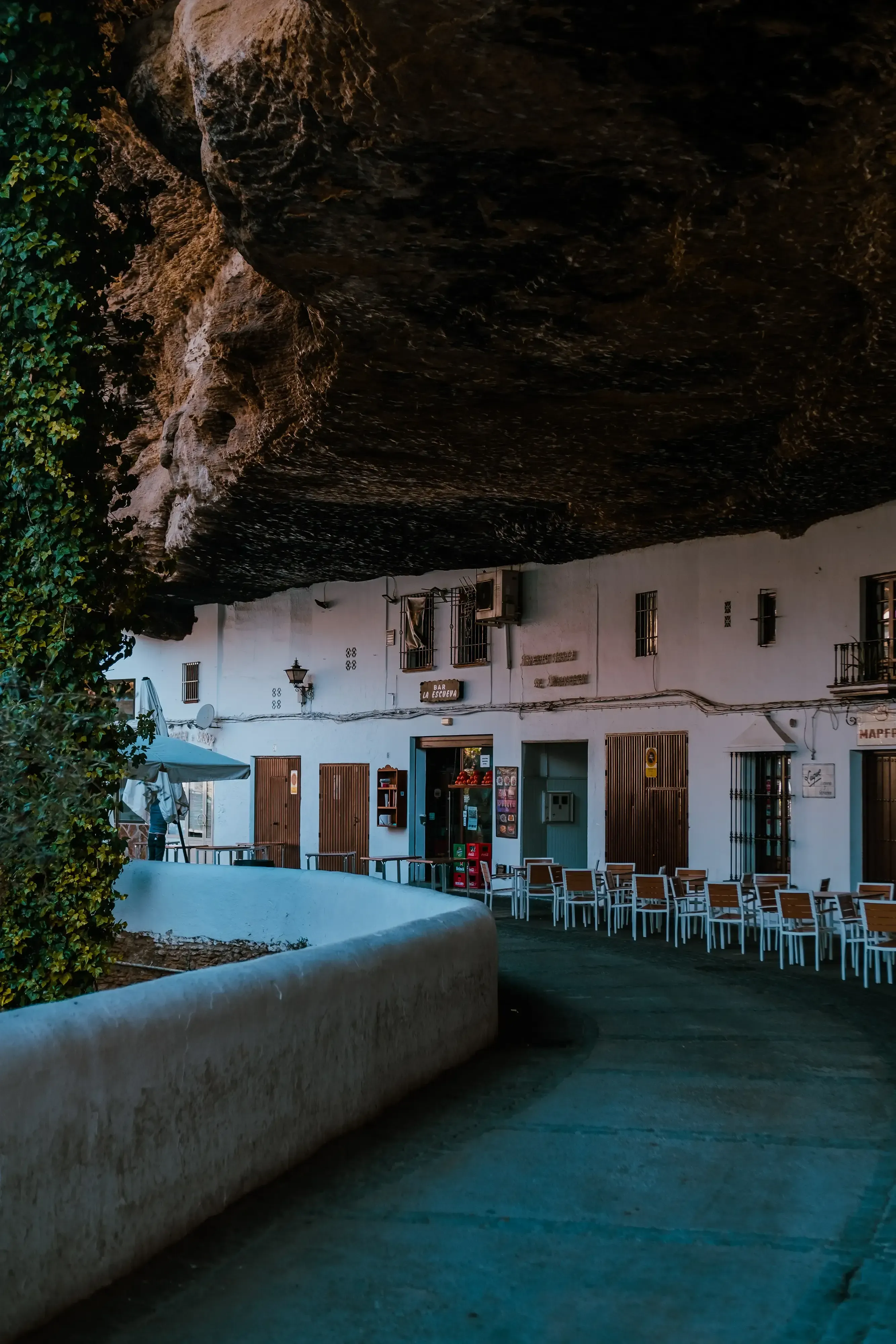 Shops built directly into the space under the rock overhang in Setenil de la botegas