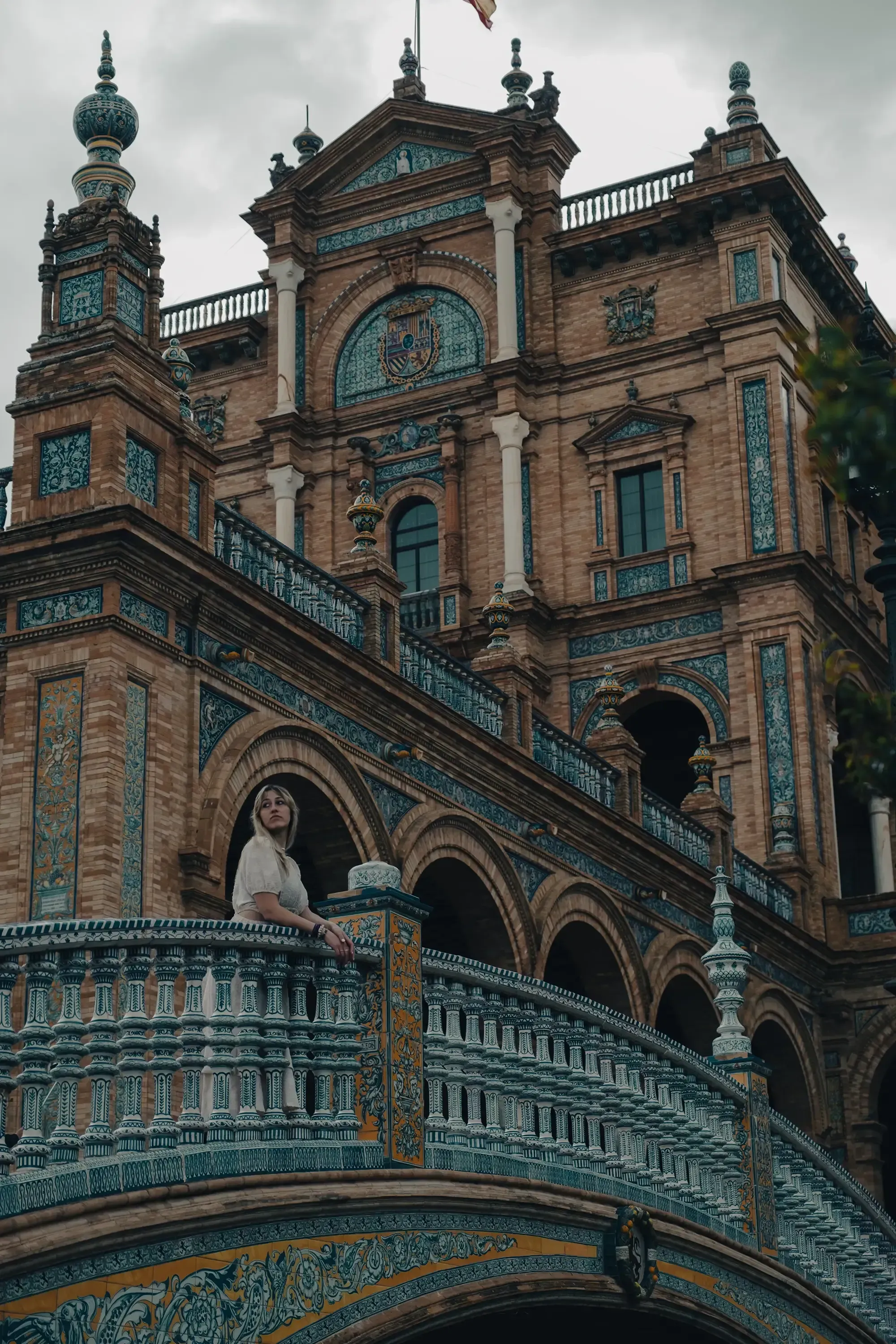 Letizia standing on one of the decorative bridges in Seville's Plaza de España.