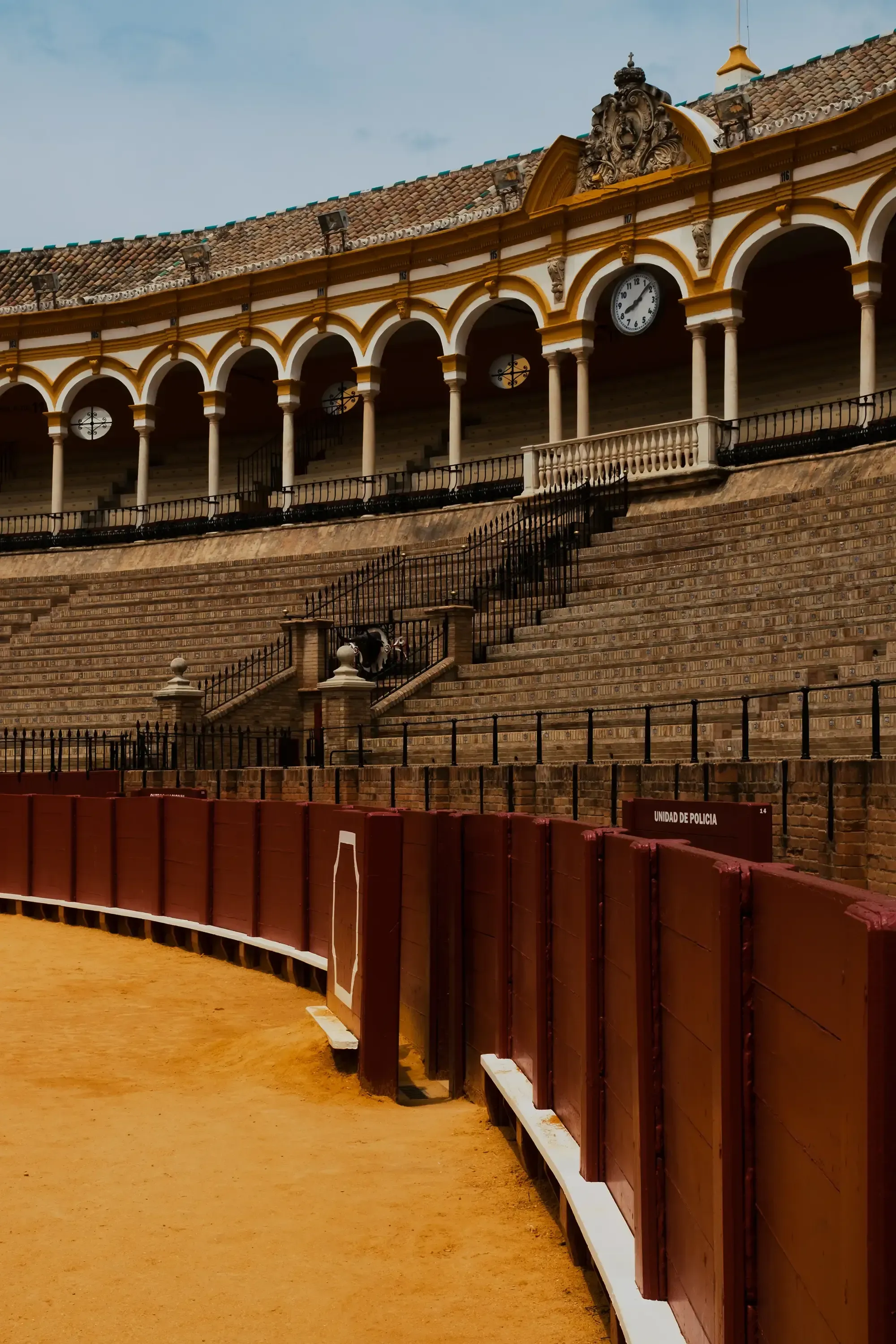 The tiered seating stands (tribunes) of the Plaza de Toros bullring in Seville.