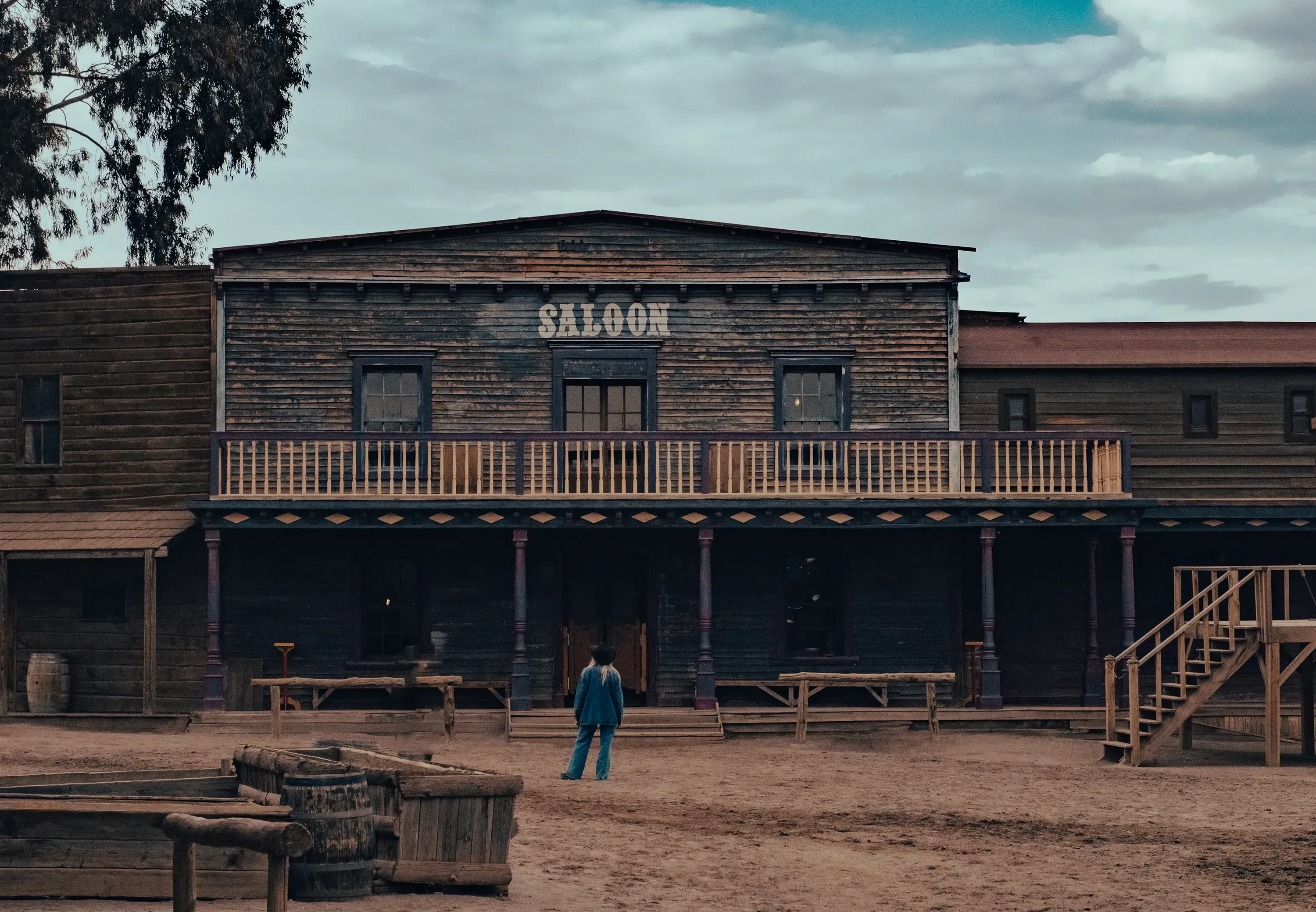 Letizia standing in front of the classic Saloon entrance at the Fort Bravo Western movie set.