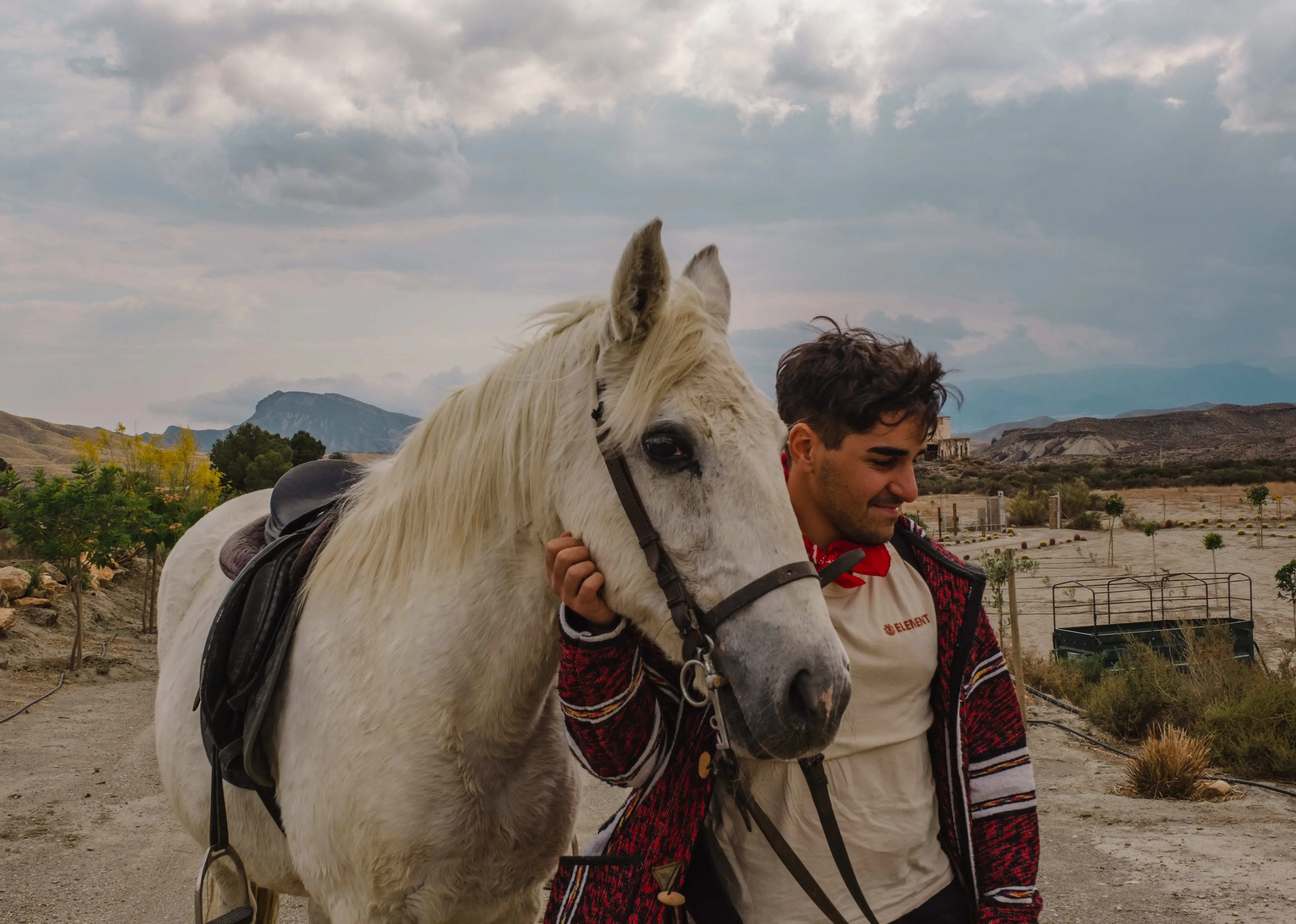 Ieser posing with a horse in the arid landscape of the Tabernas Desert.