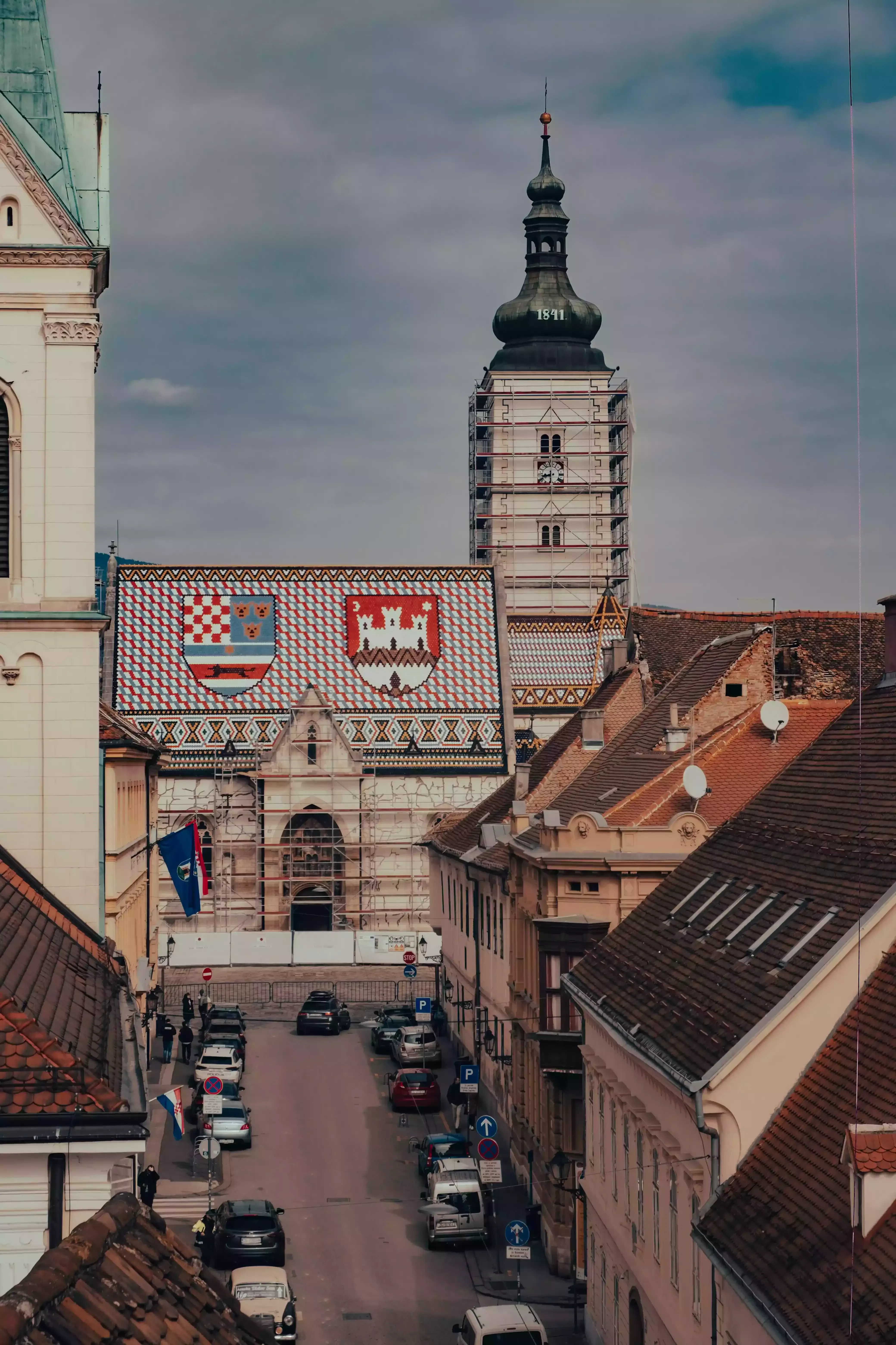 The iconic St. Mark's Church in Zagreb, known for its vividly tiled, colorful roof viewed from the top