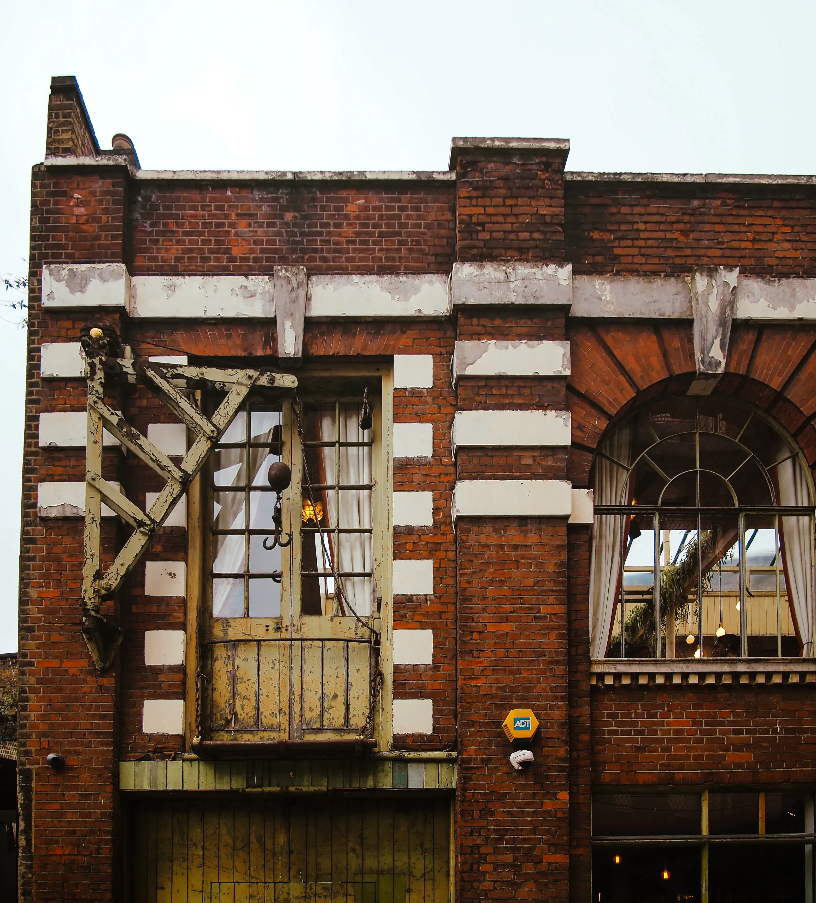 The brick exterior of a decommissioned industrial factory building.