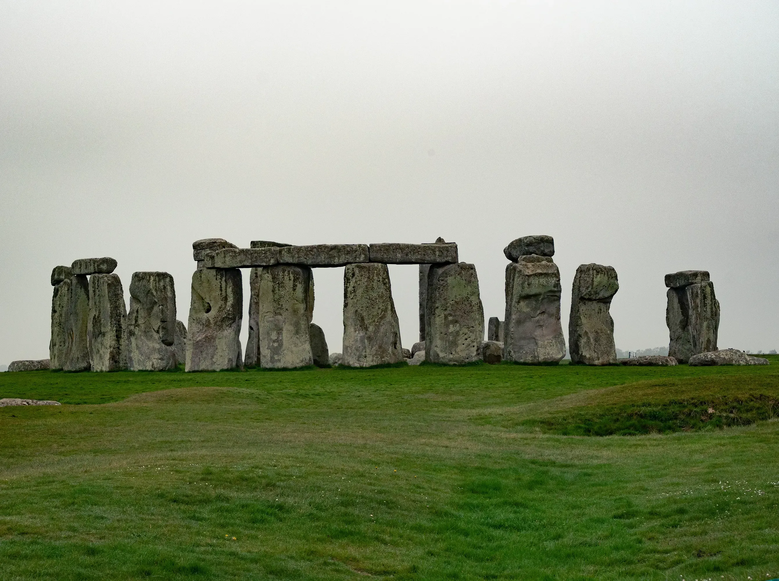Wide view of the complete prehistoric circle of the Stonehenge monument.