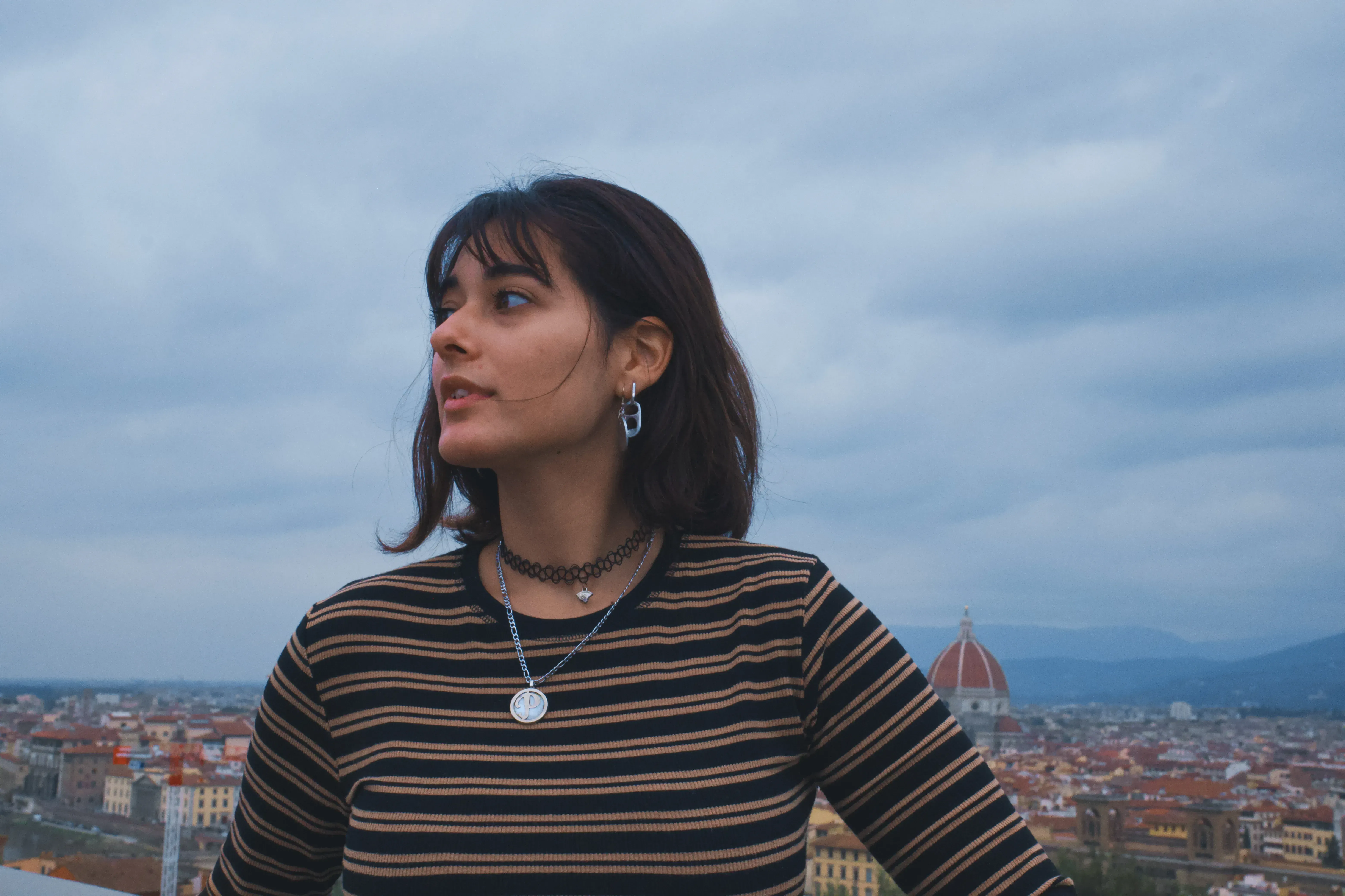 Paulina posing in Florence with the prominent dome of the Duomo visible in the background.
