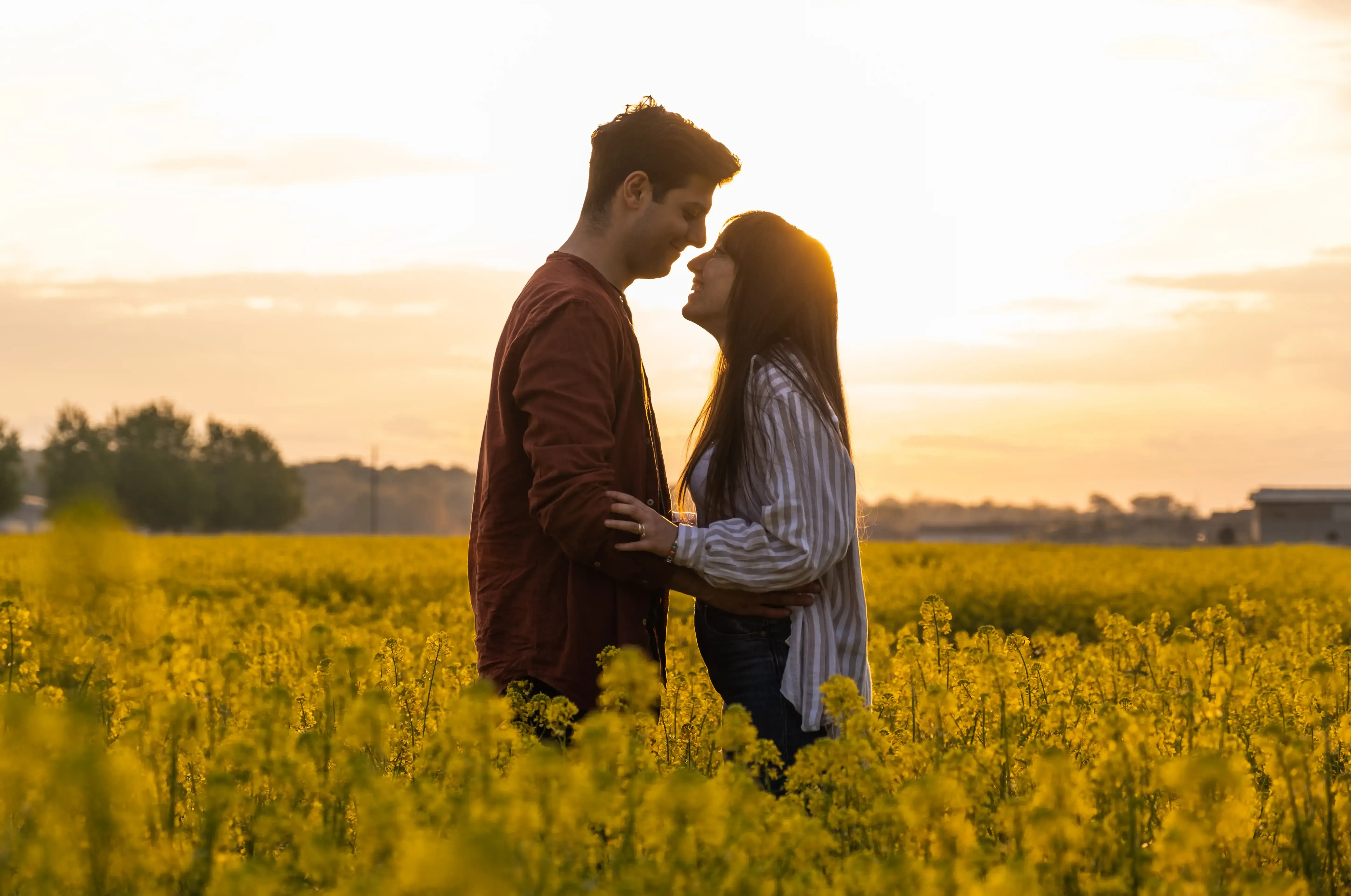 Giuseppe and Indya with the sun behind them at golden hour