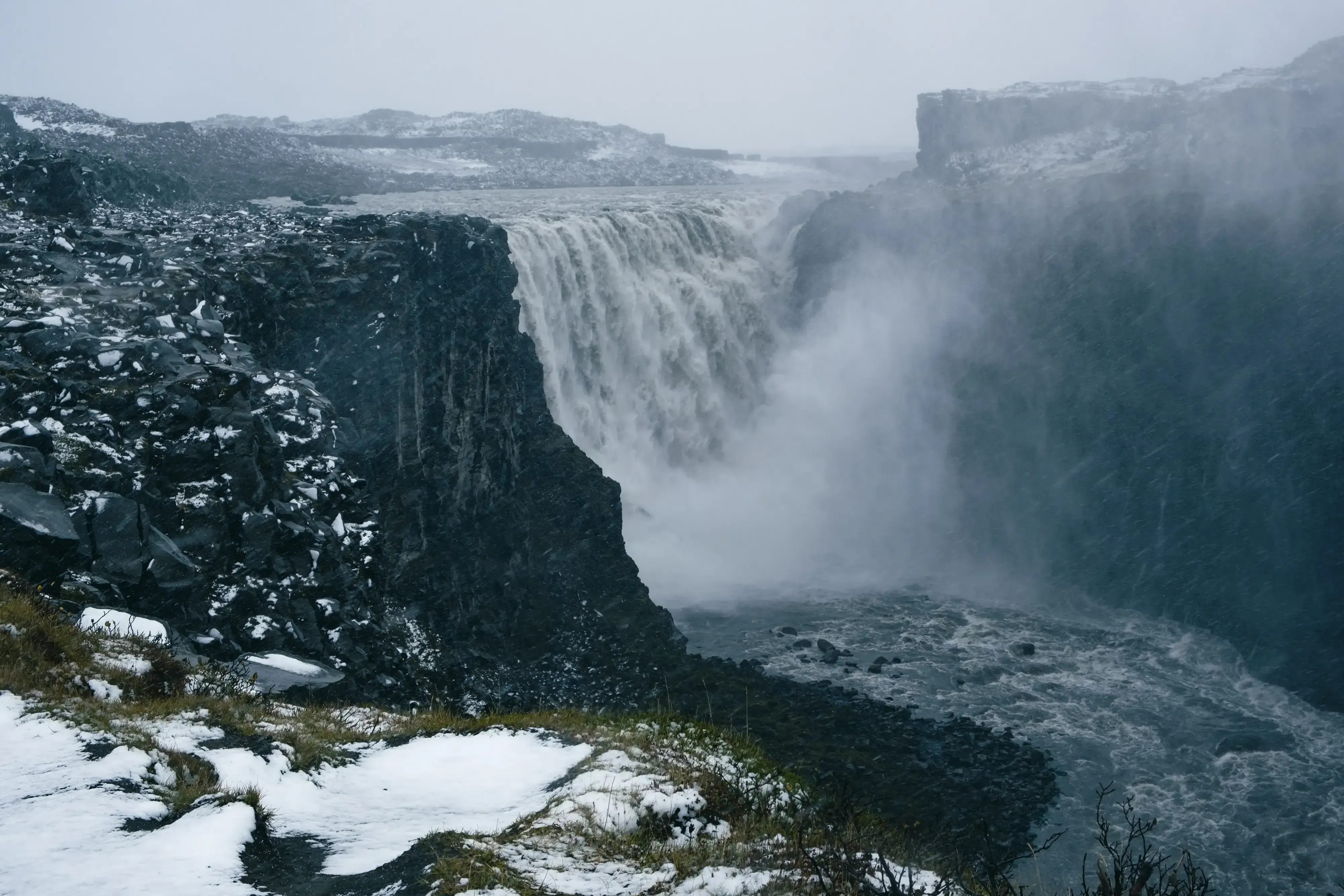 The extremely powerful Dettifoss waterfall, showcasing its immense volume and spray (turbulence).