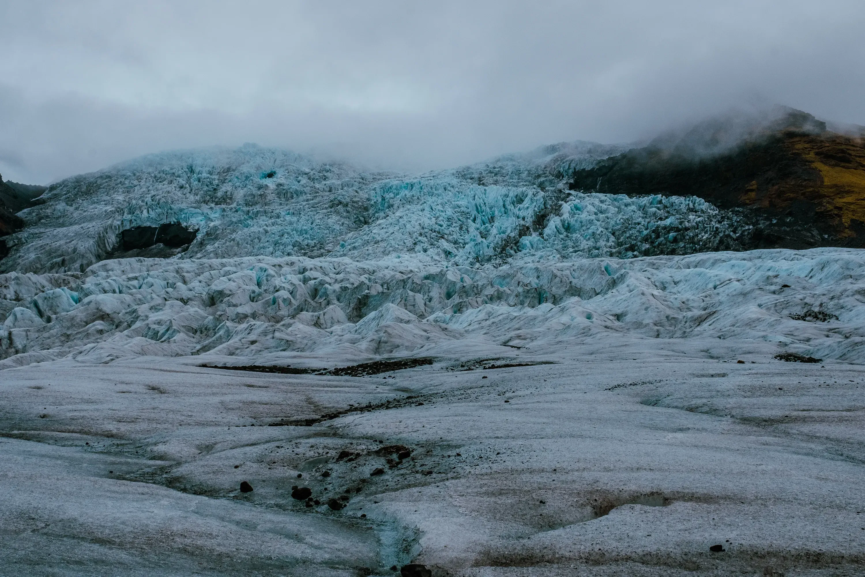 The peak of Hvannadalshnjúkur glacier (Iceland's highest peak) partially obscured by low-lying fog or mist.