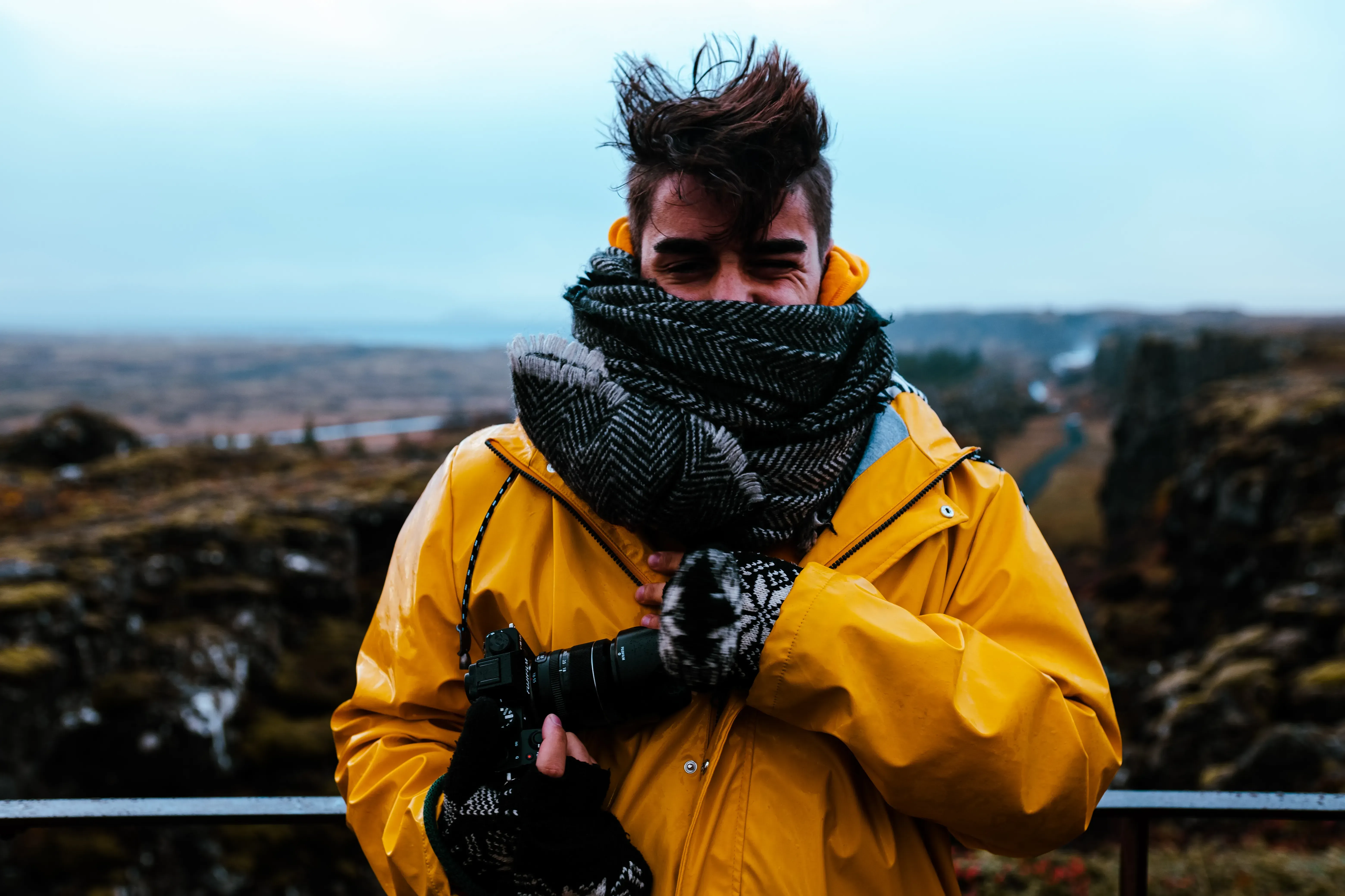 A portrait shot of Ieser in the rugged, wide landscape of Iceland.