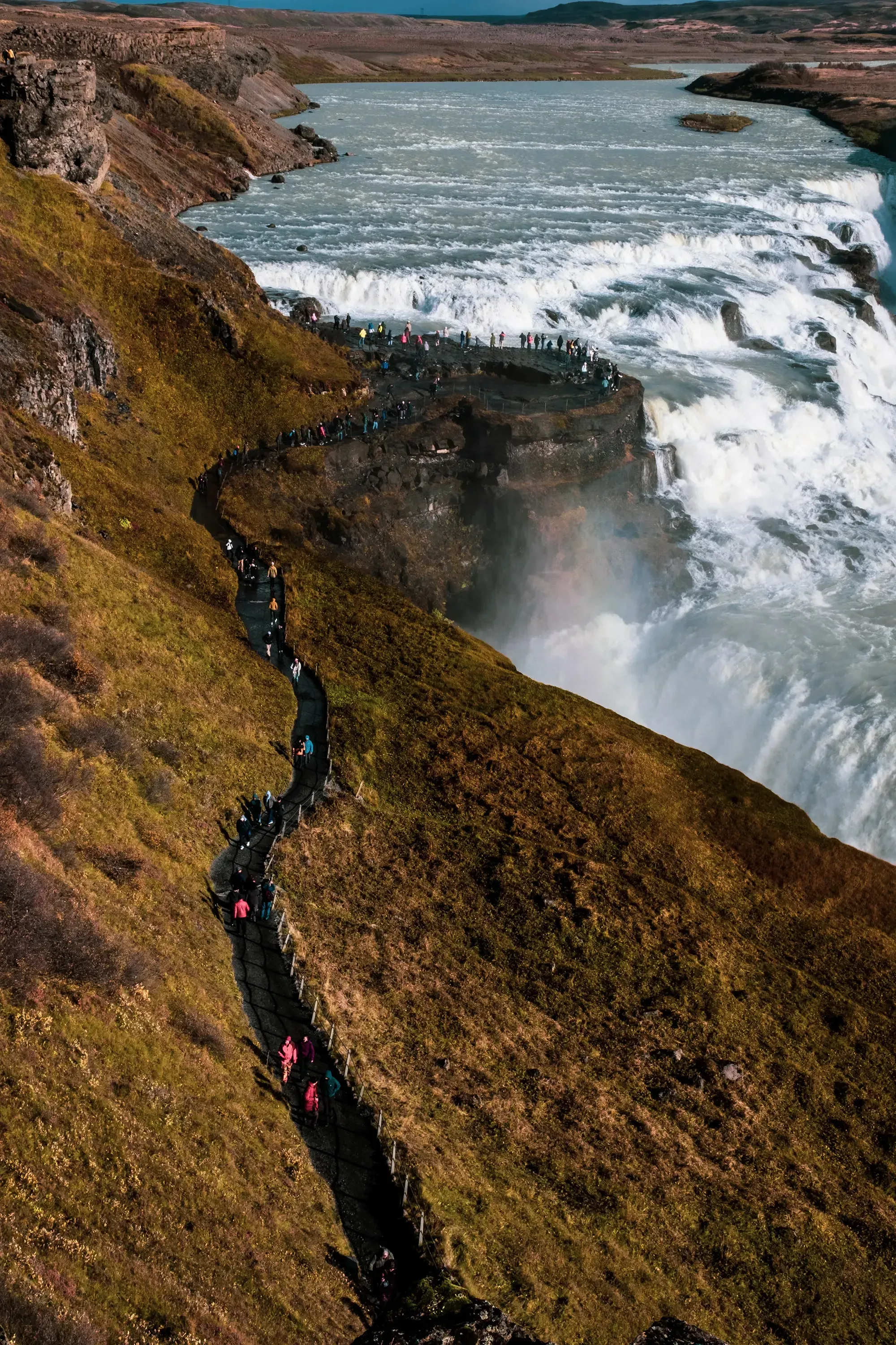 The designated pathway or trail leading down to the viewing area of the Gullfoss waterfall.