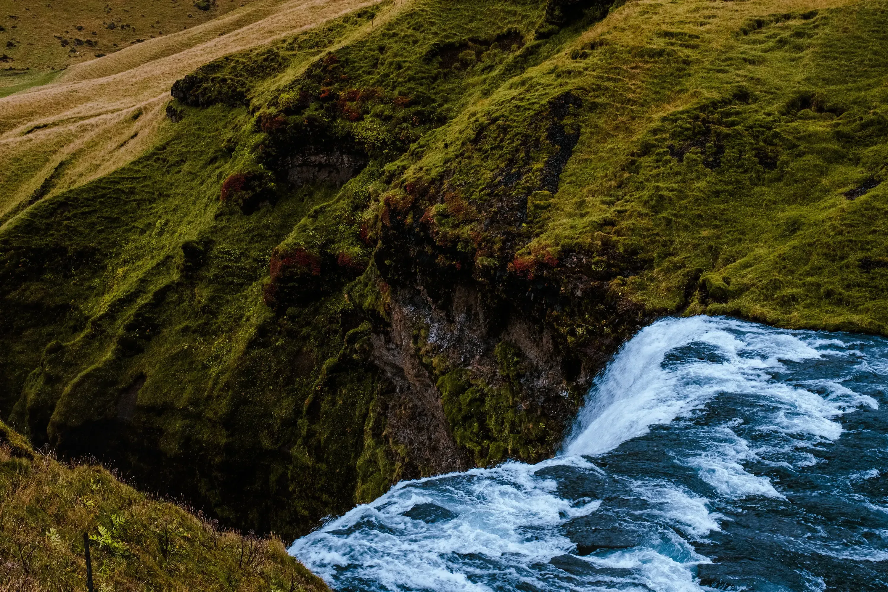 Close-up view of the exact point where the water of Skógafoss crashes onto the rocks or into the pool.
