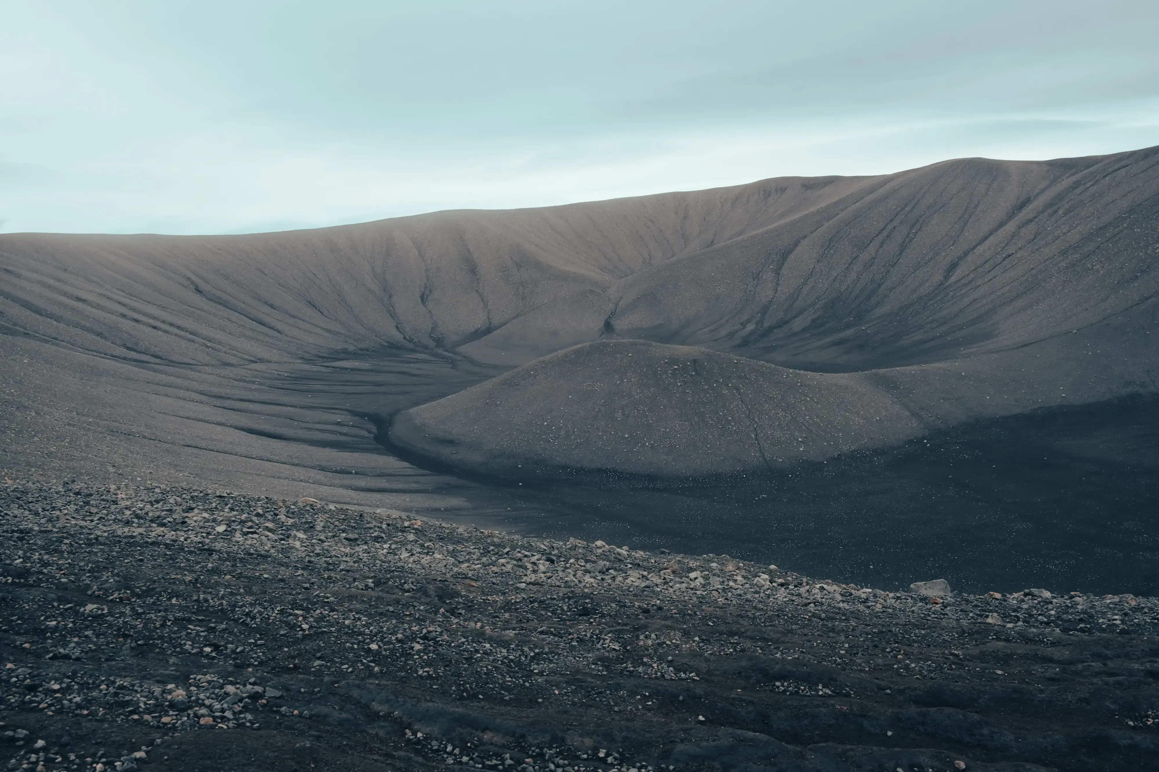 The large, circular caldera and cone of an extinct Icelandic volcano crater.