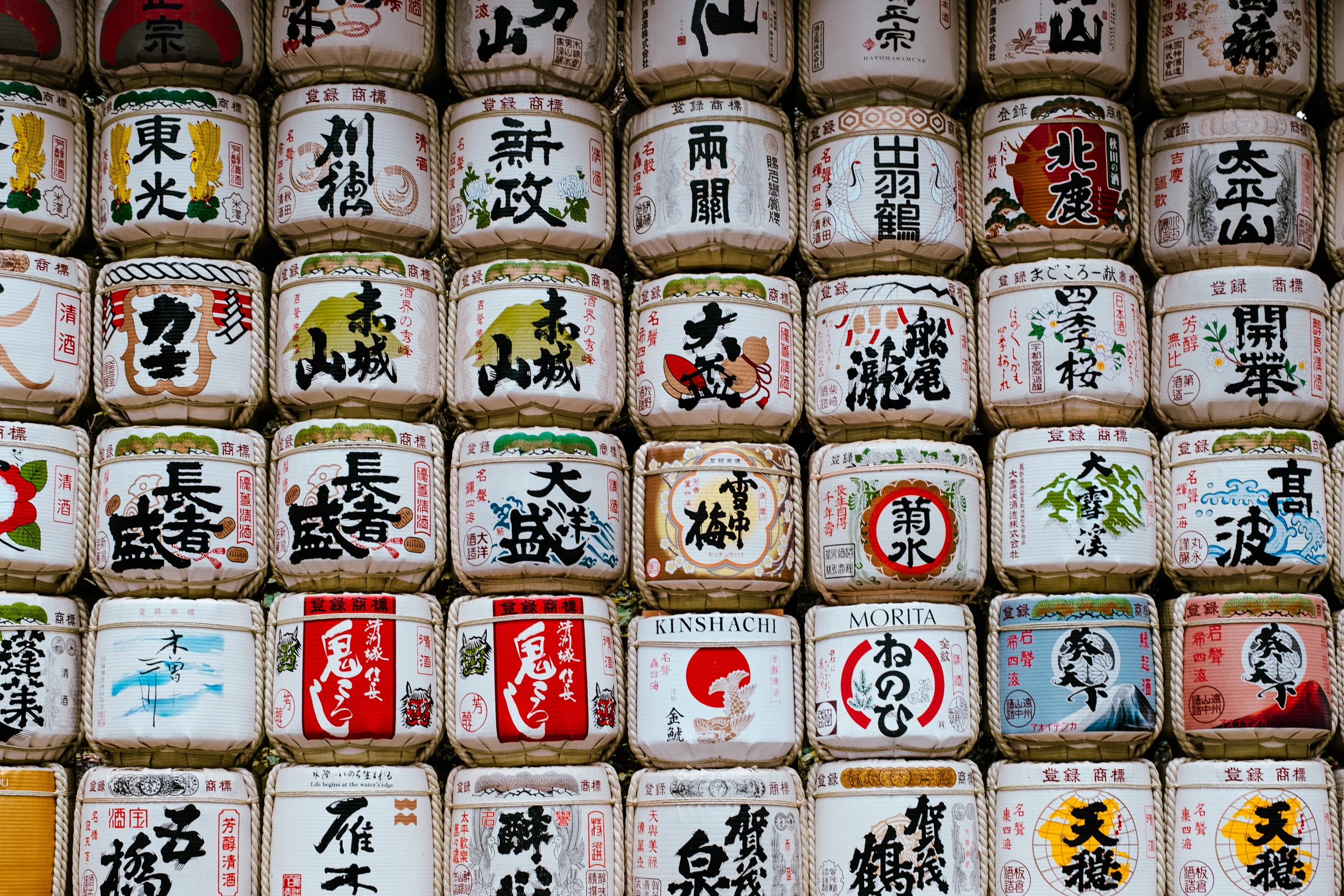Decorative Sake barrels (Kazaridaru) and wine barrels displayed at Meiji Jingu Shrine