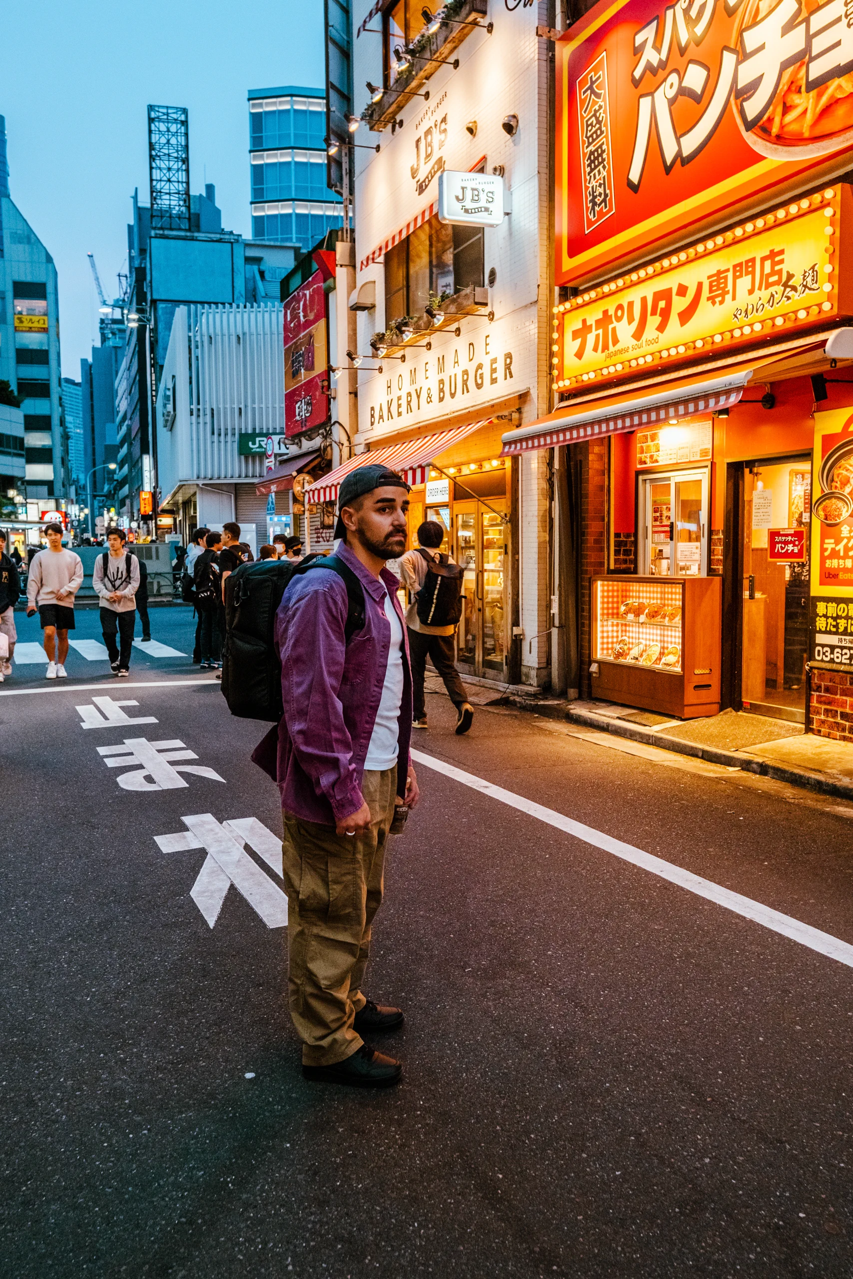 Ieser walking through the streets of Tokyo at night