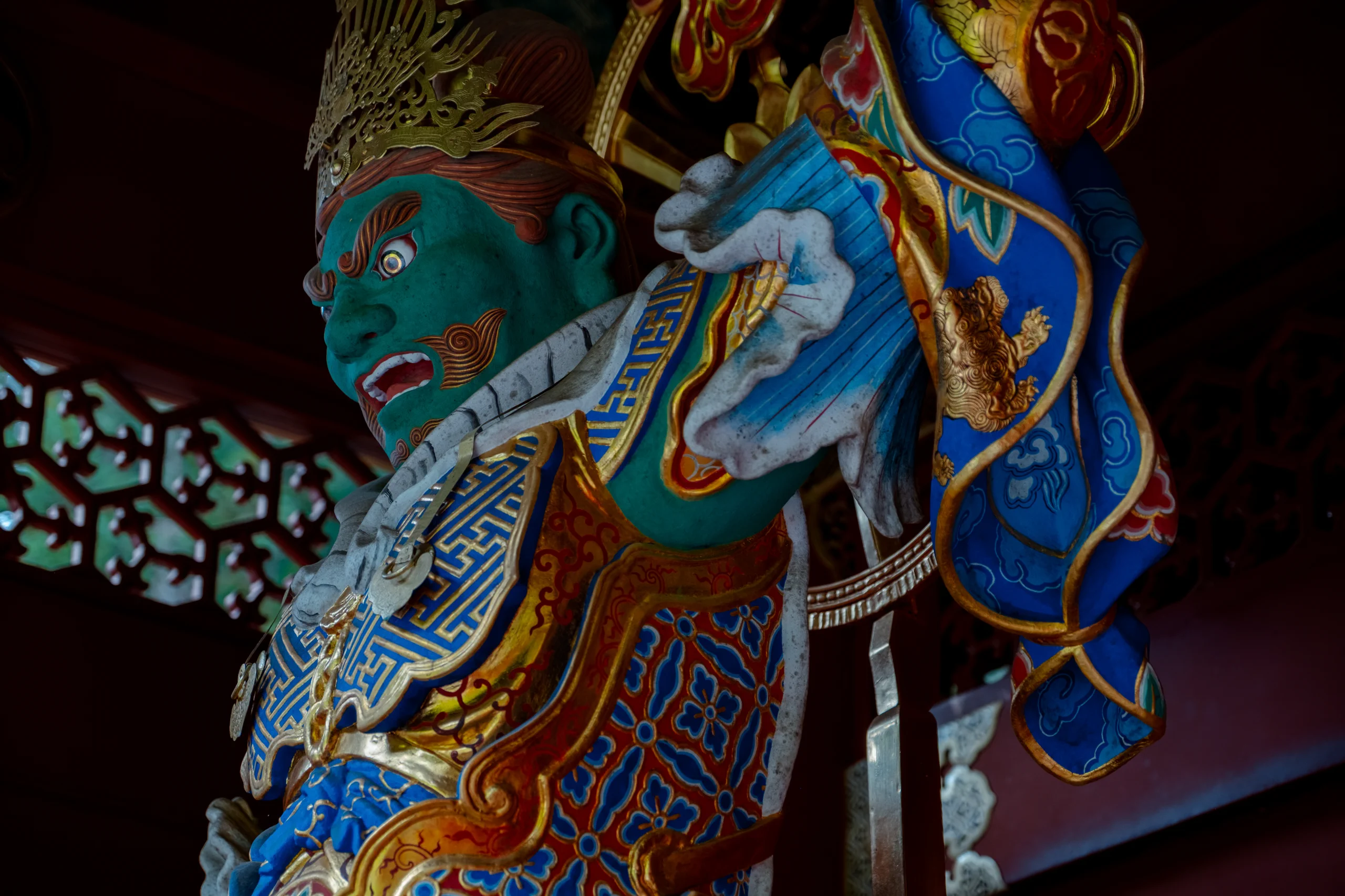 A large guardian statue at a temple gate in Nikko Toshogu Shrine