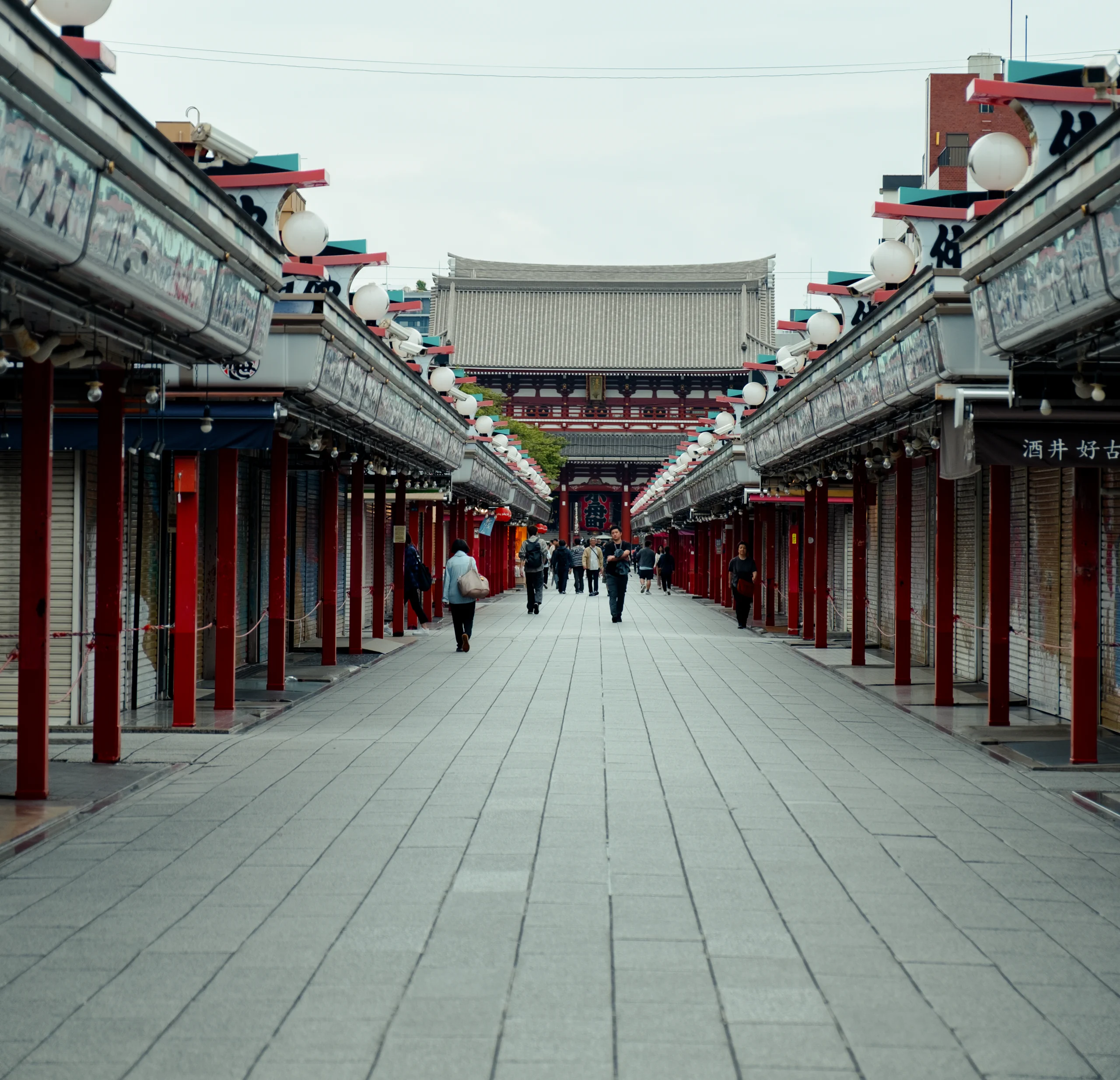 Closed shops with shutter art on Nakamise Shopping Street near Sensoji Temple