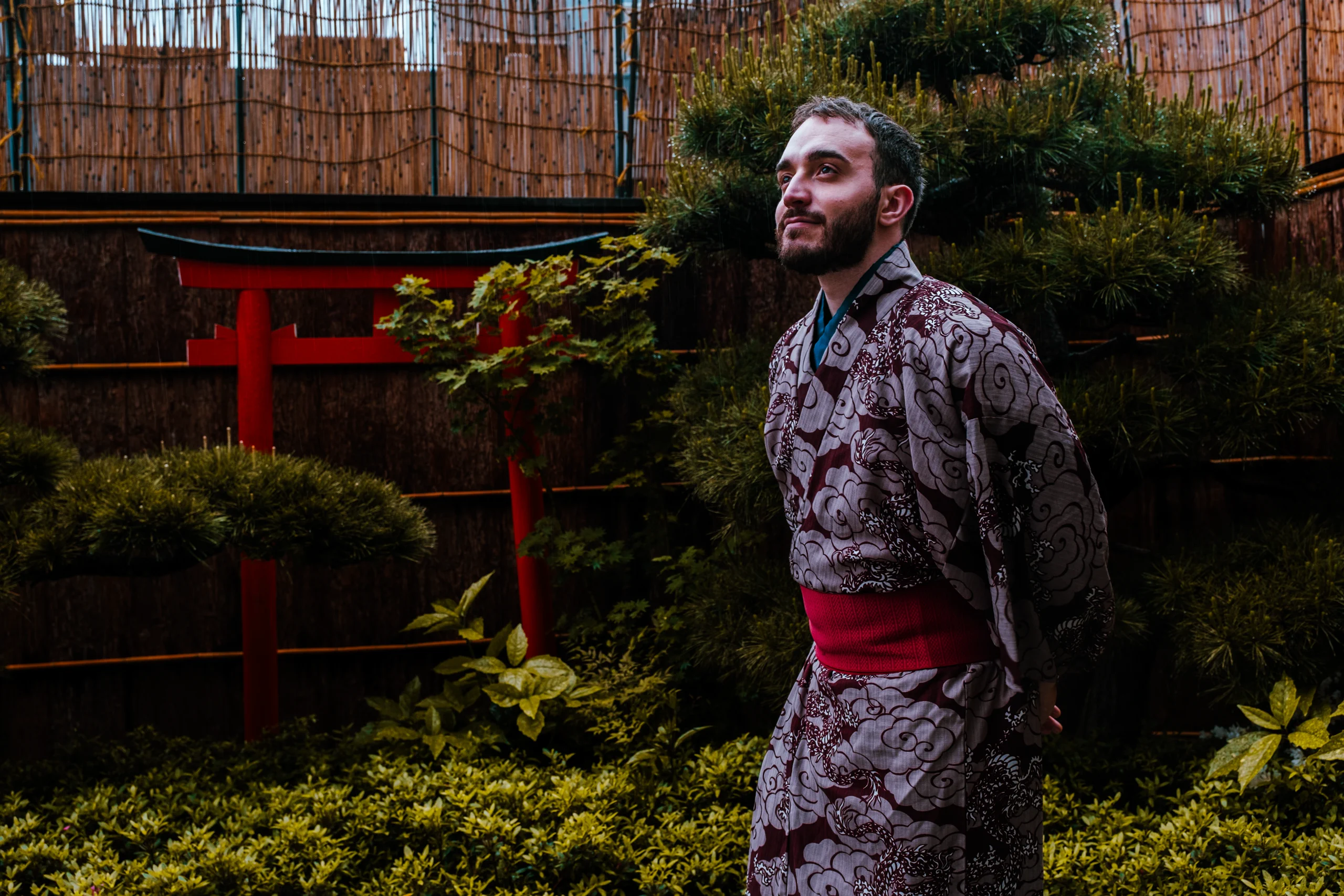 Stefano walking while wearing a red kimono