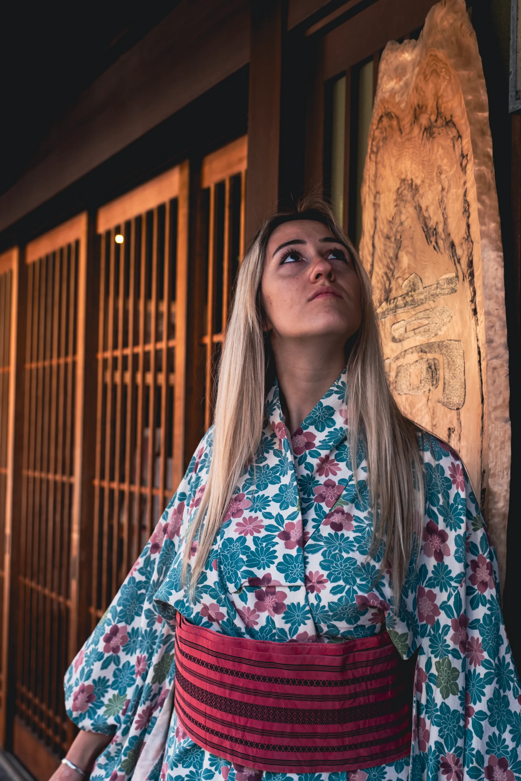 Letizia posing in front of a traditional wooden Machiya house in Kyoto