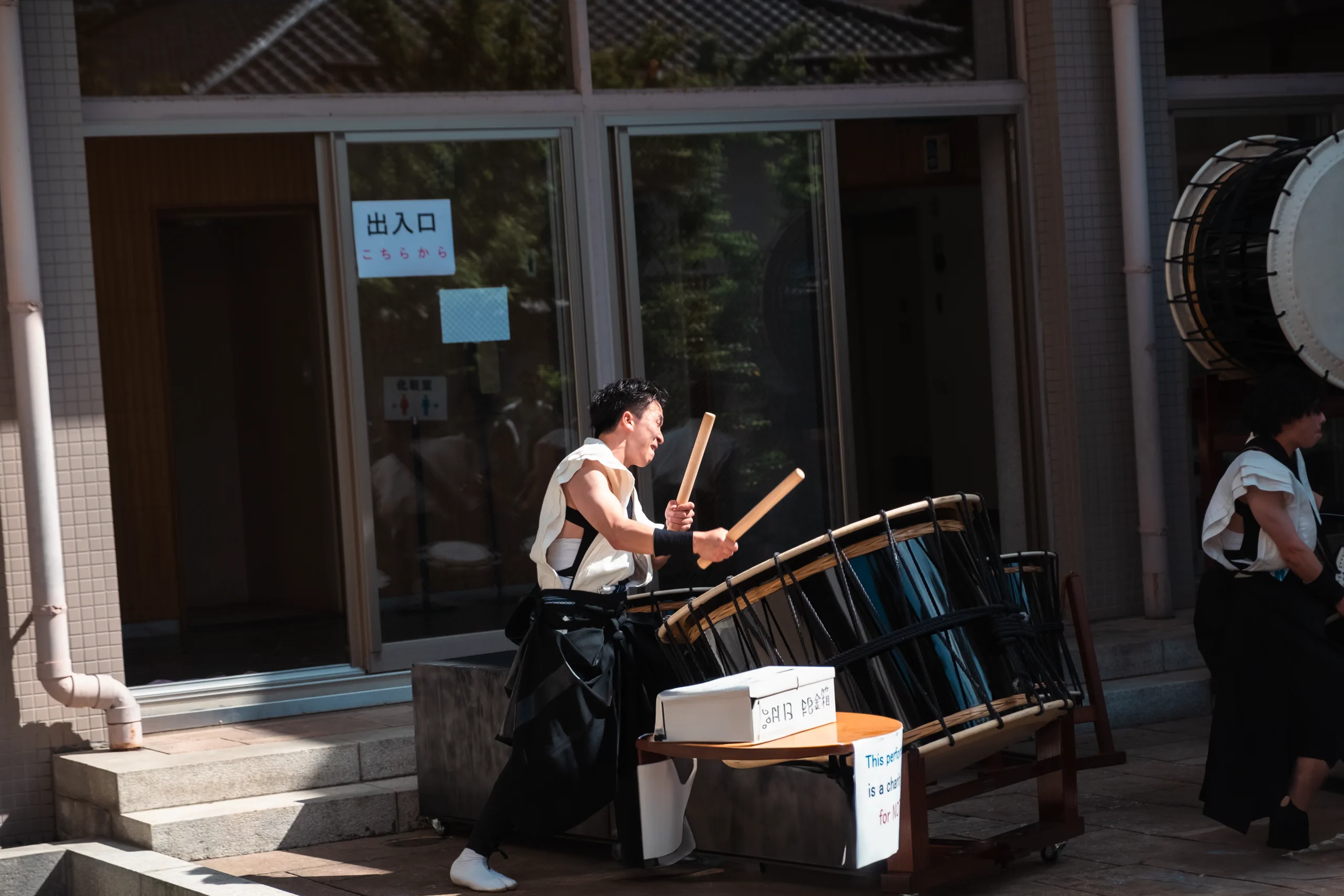 Japanese boy playing a traditional Taiko drum