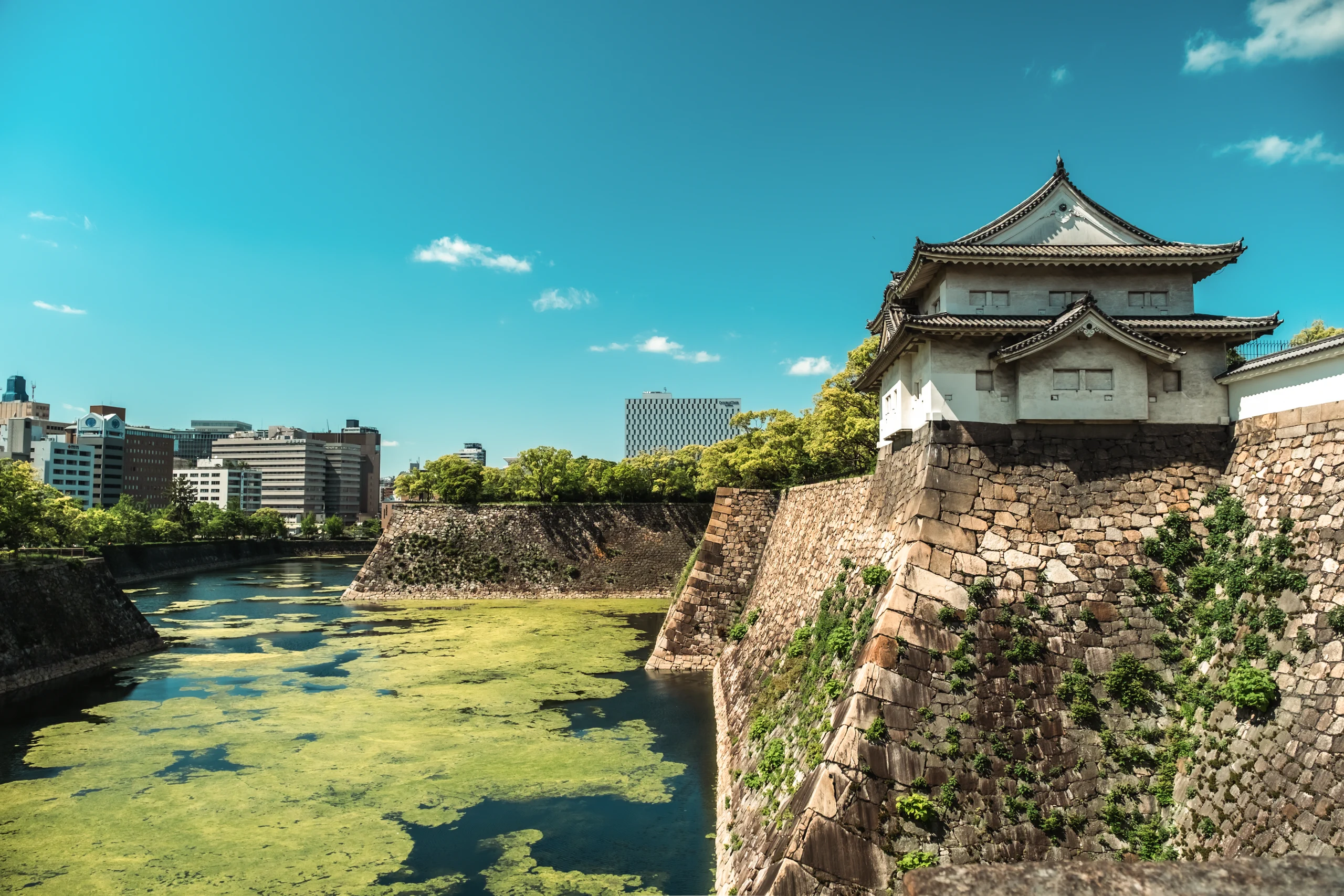 Stone walls and water moat surrounding Himeji Castle