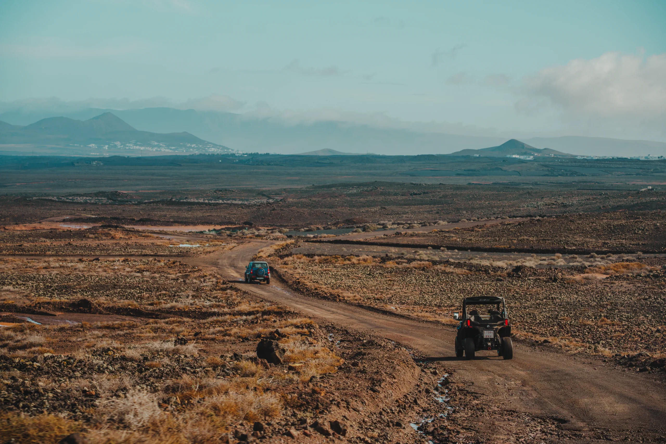 A jeep followed by a buggy in the offroads of lanzarote