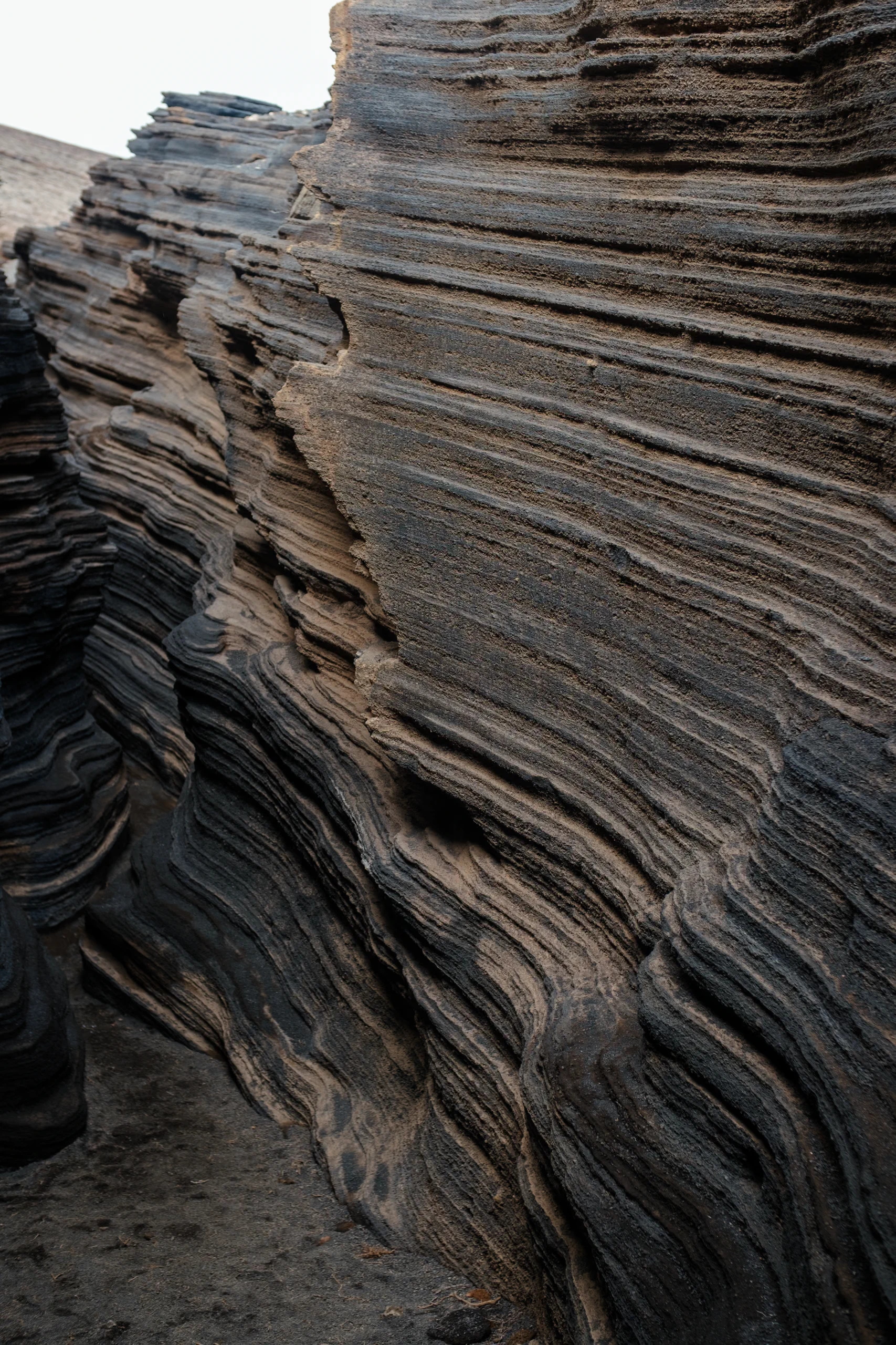 Close-up of the eroded volcanic texture and layered patterns at Las Grietas.