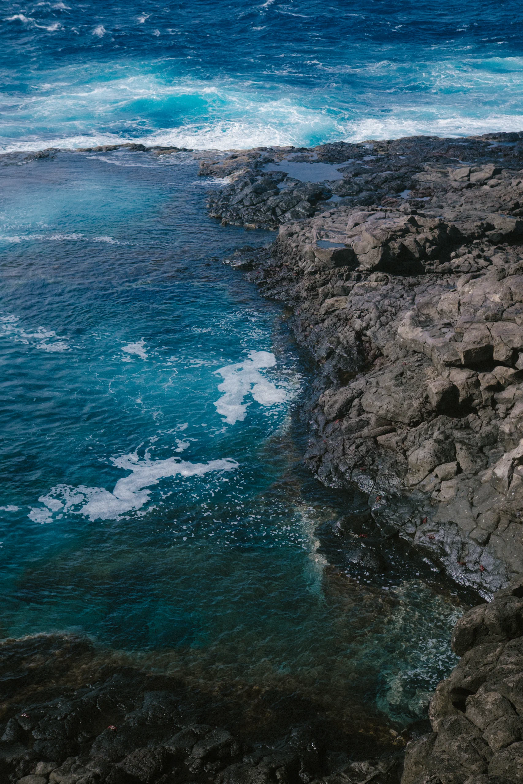 Rocks and sea in the volcanic rock along the coast.
