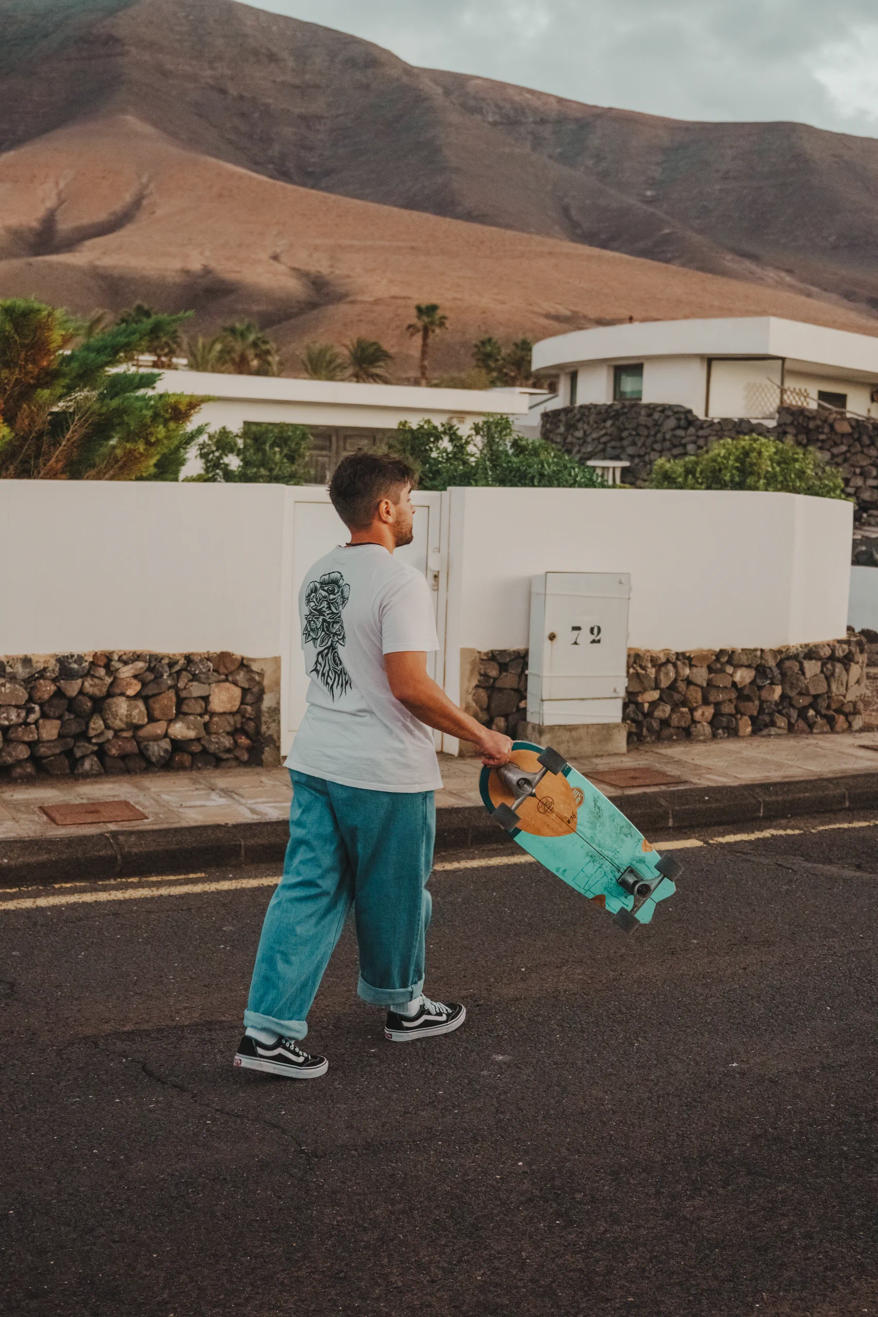 Me walking in Famara with a skateboard