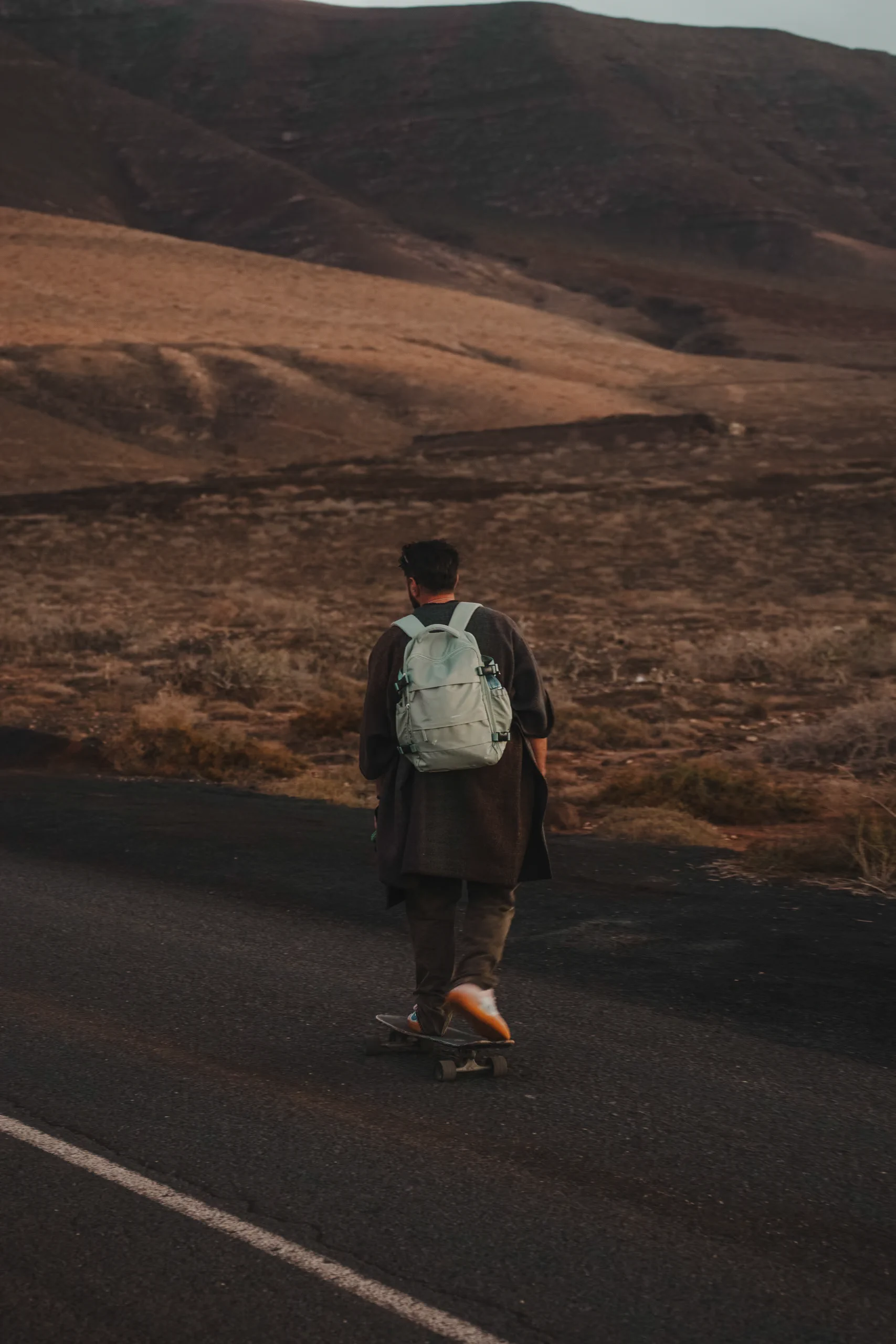 Iair skating up a road in Famara beach
