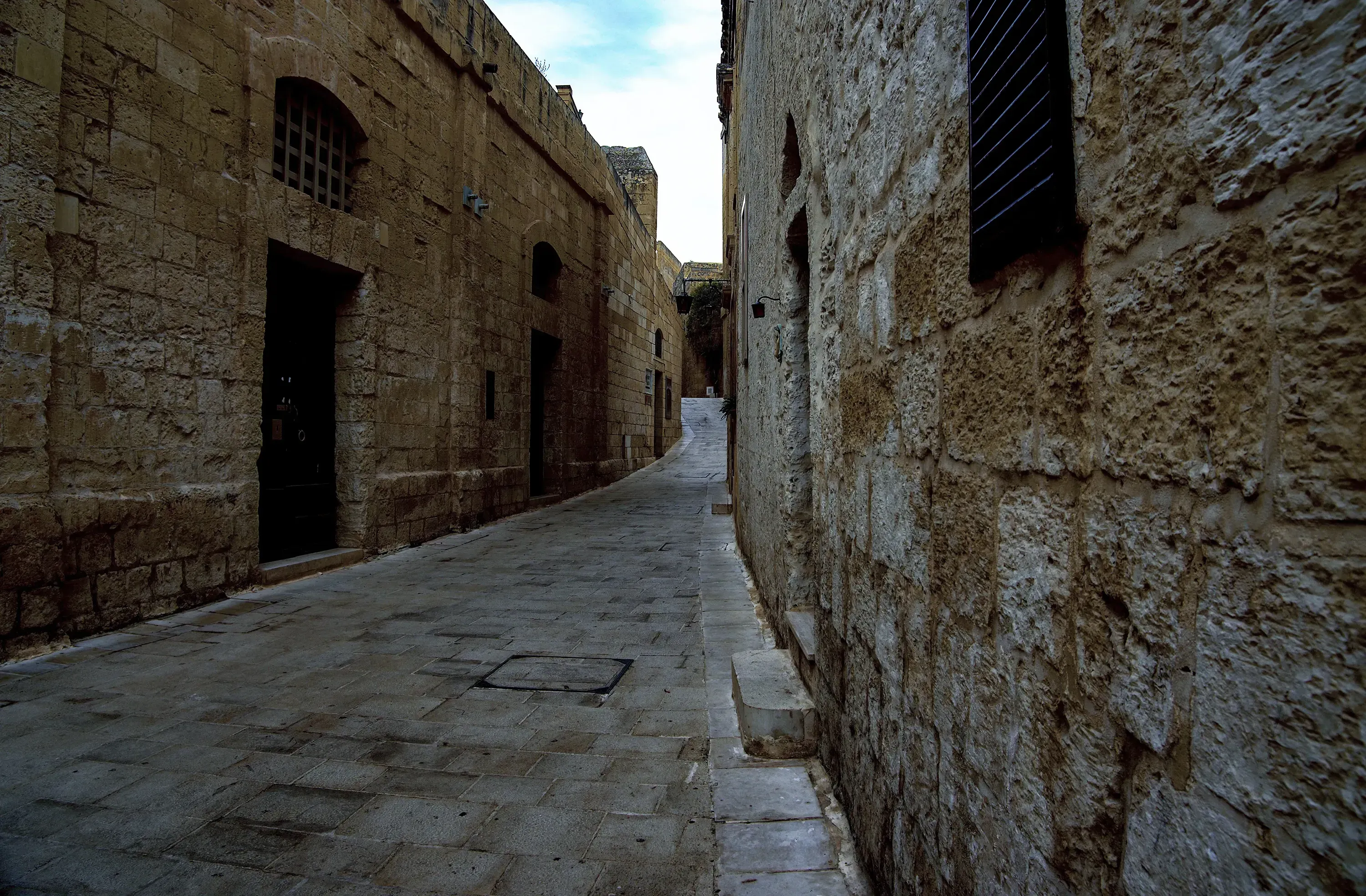 Another quiet stone street in Mdina, highlighting the historic architecture.