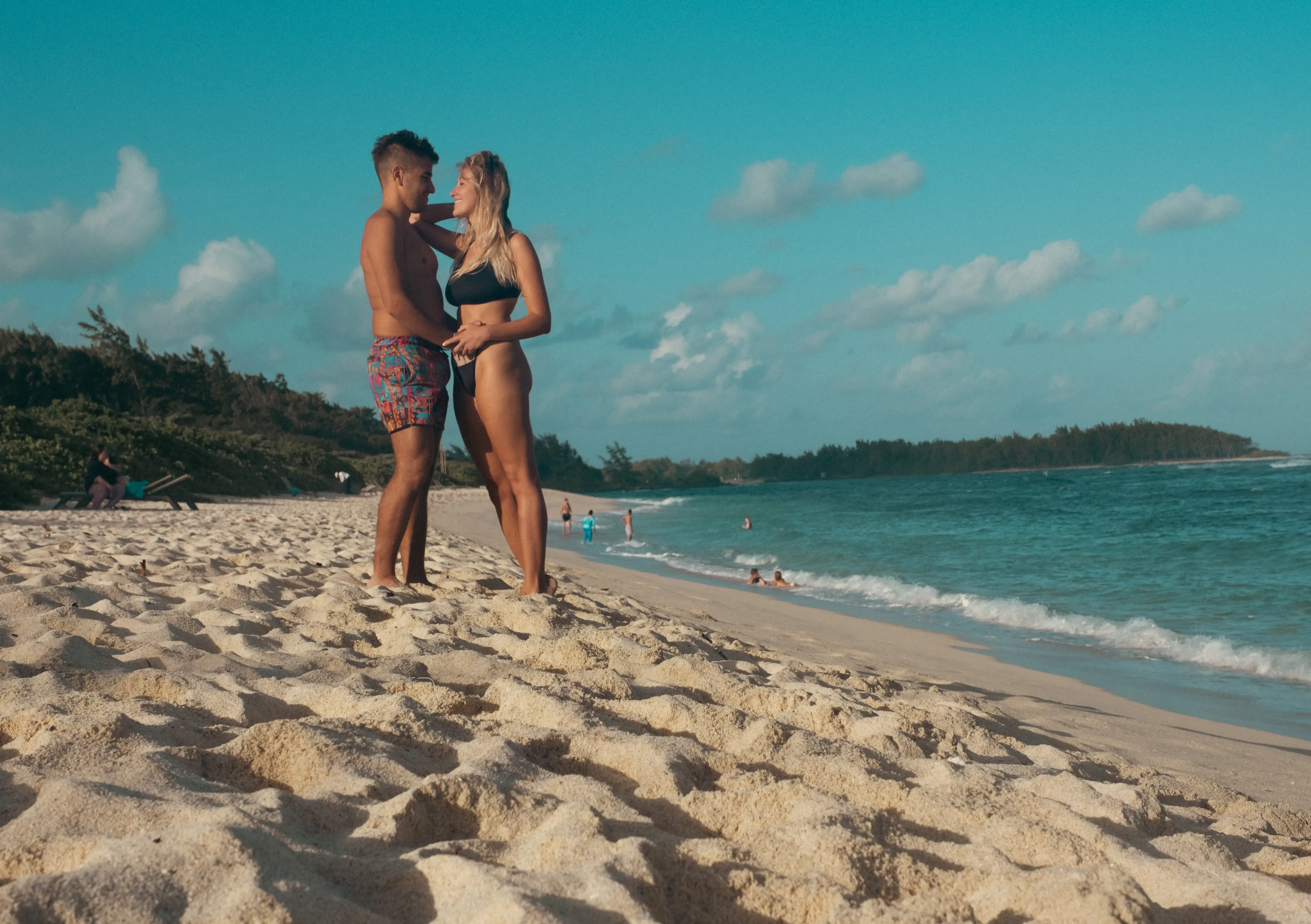 Ieser and Letizia posing together on the sandy expanse of La Cambuse beach.