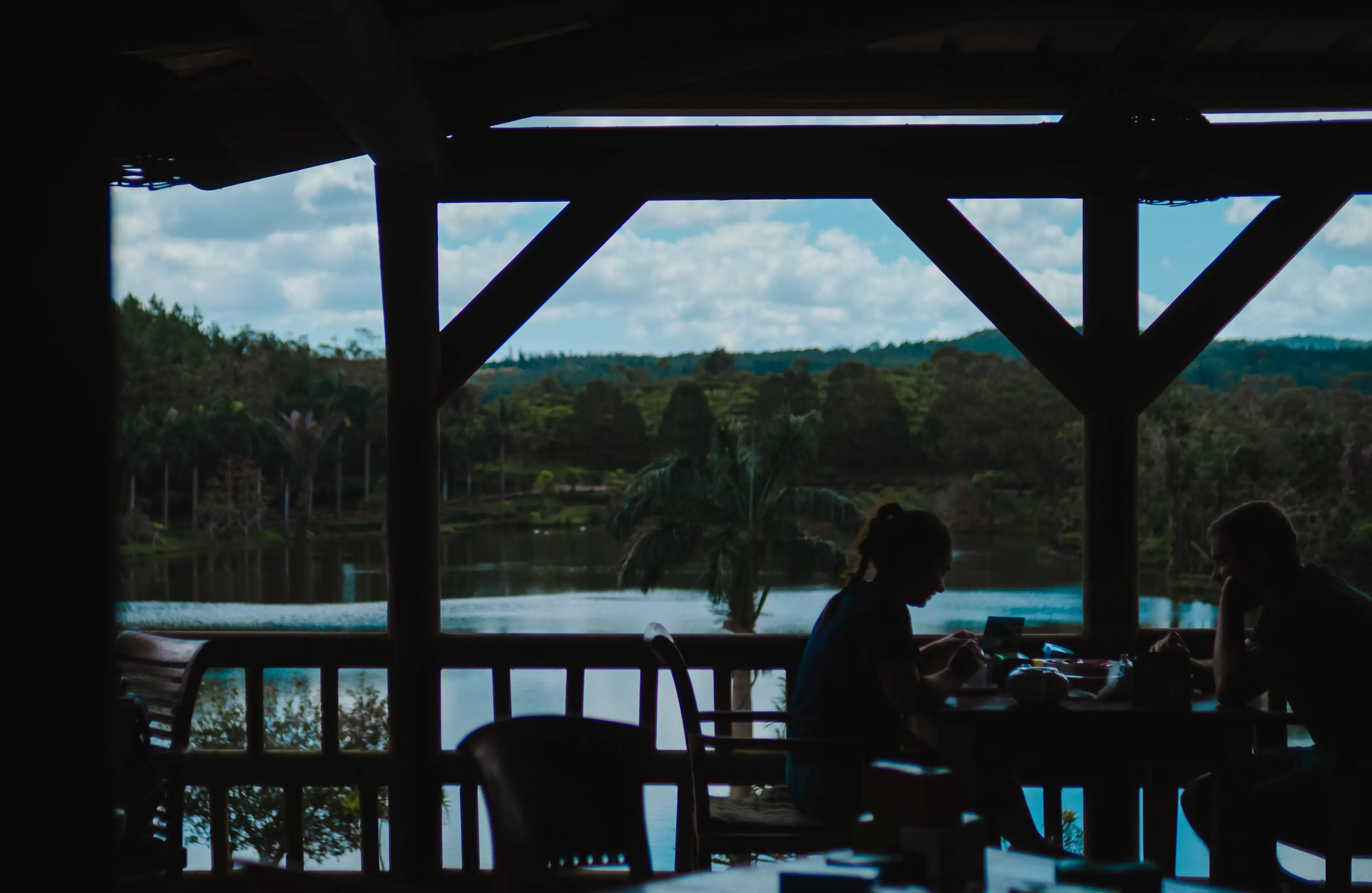 The panoramic terrace or bar at the Bois Cheri tea factory, with guests seated and tasting different varieties of Mauritian tea.