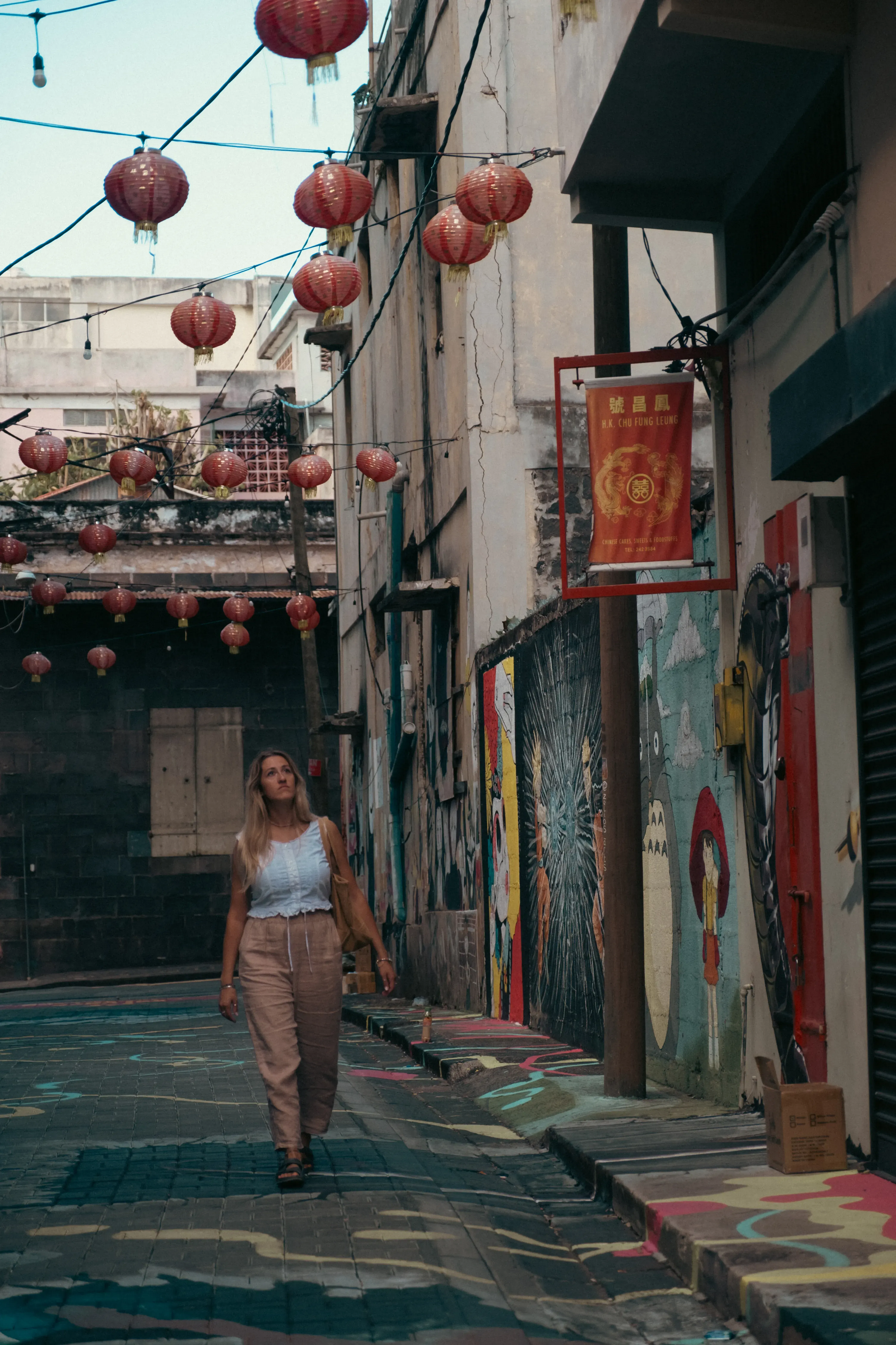 Letizia walking along the vibrant Mahebourg street in Port Louis, the capital city, known for its busy atmosphere.