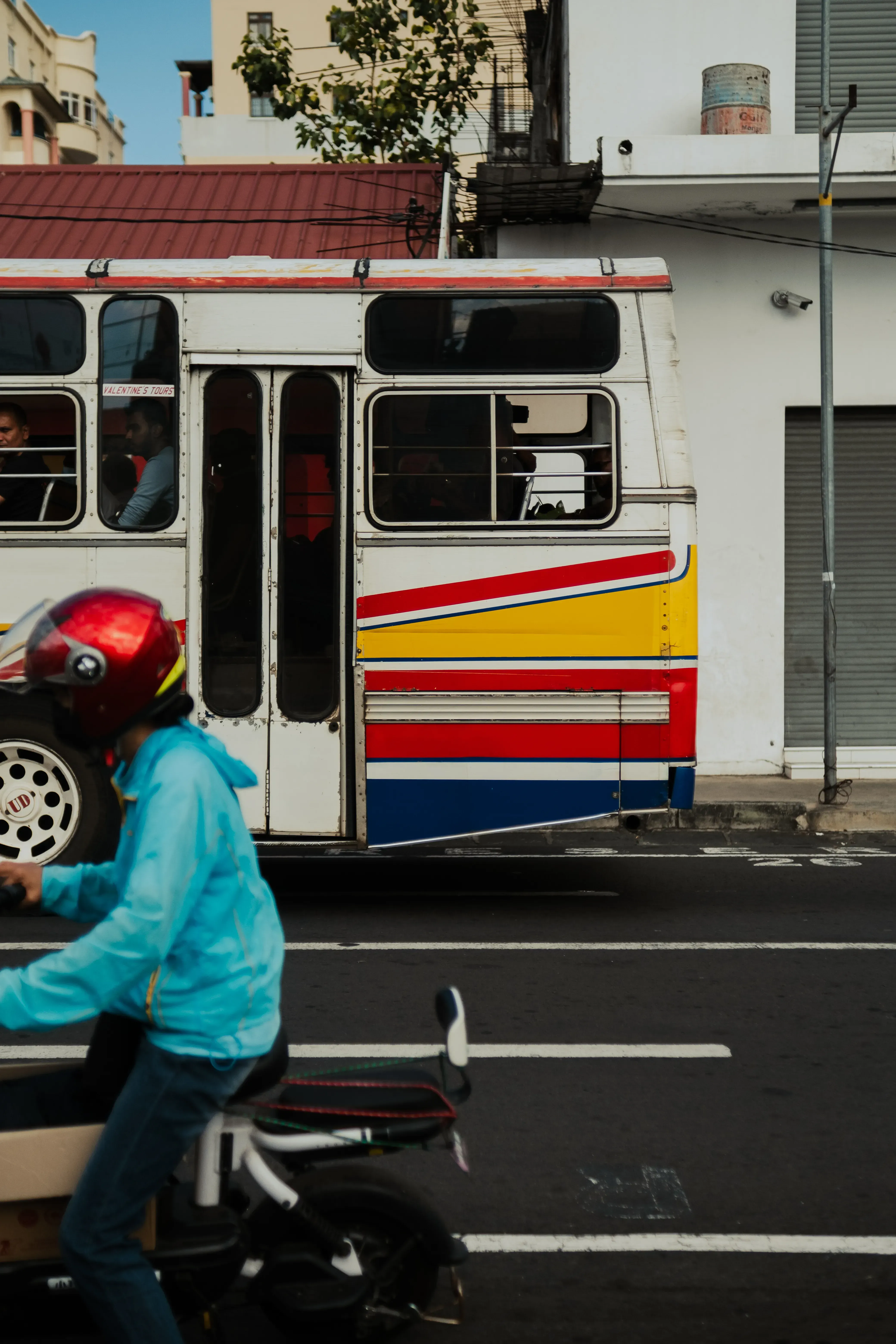 A colorful public bus (pullman) typical of the local transportation on the island of Mauritius.
