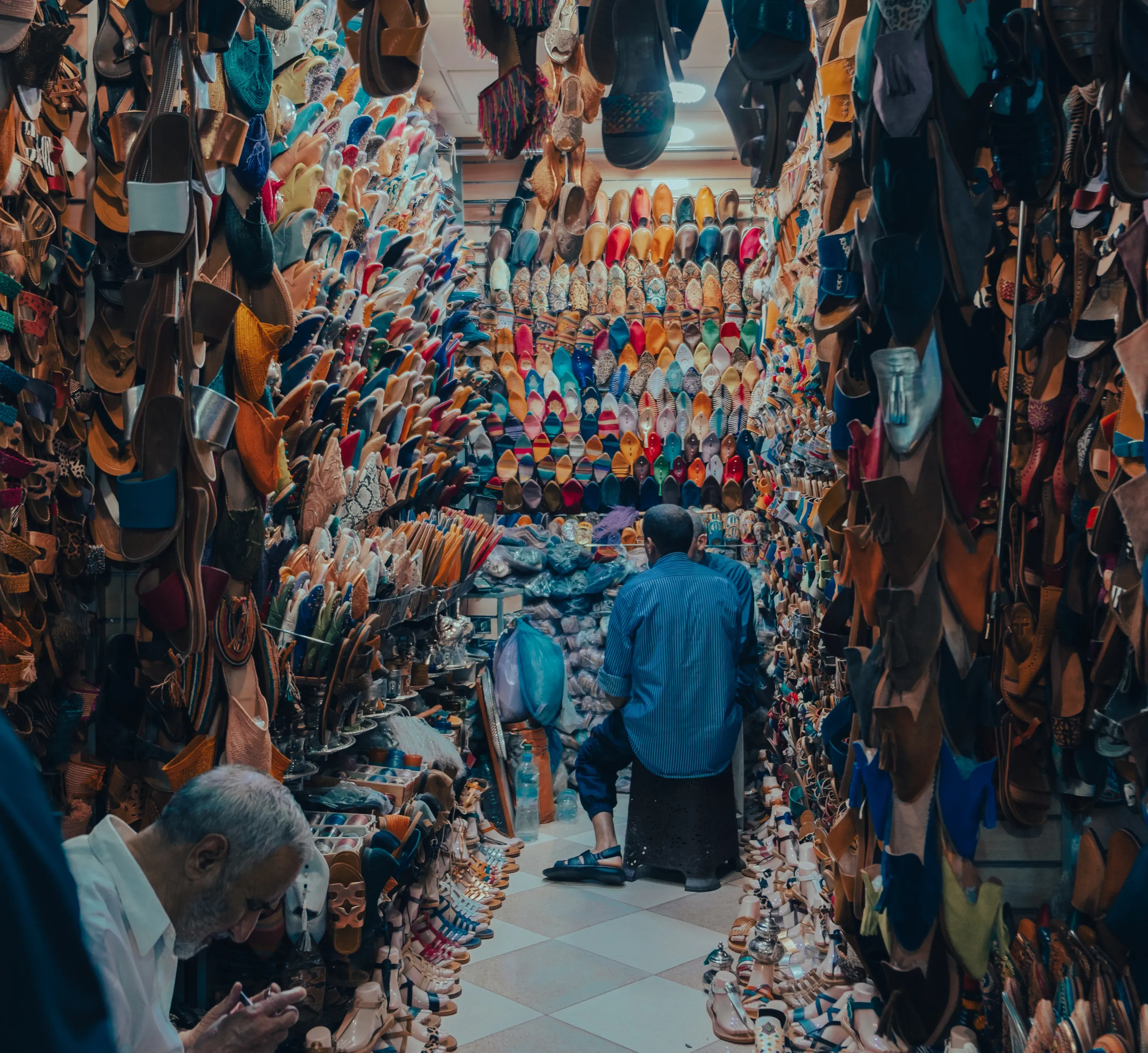 Store display filled with traditional, handcrafted Moroccan leather slippers in Marrakech.