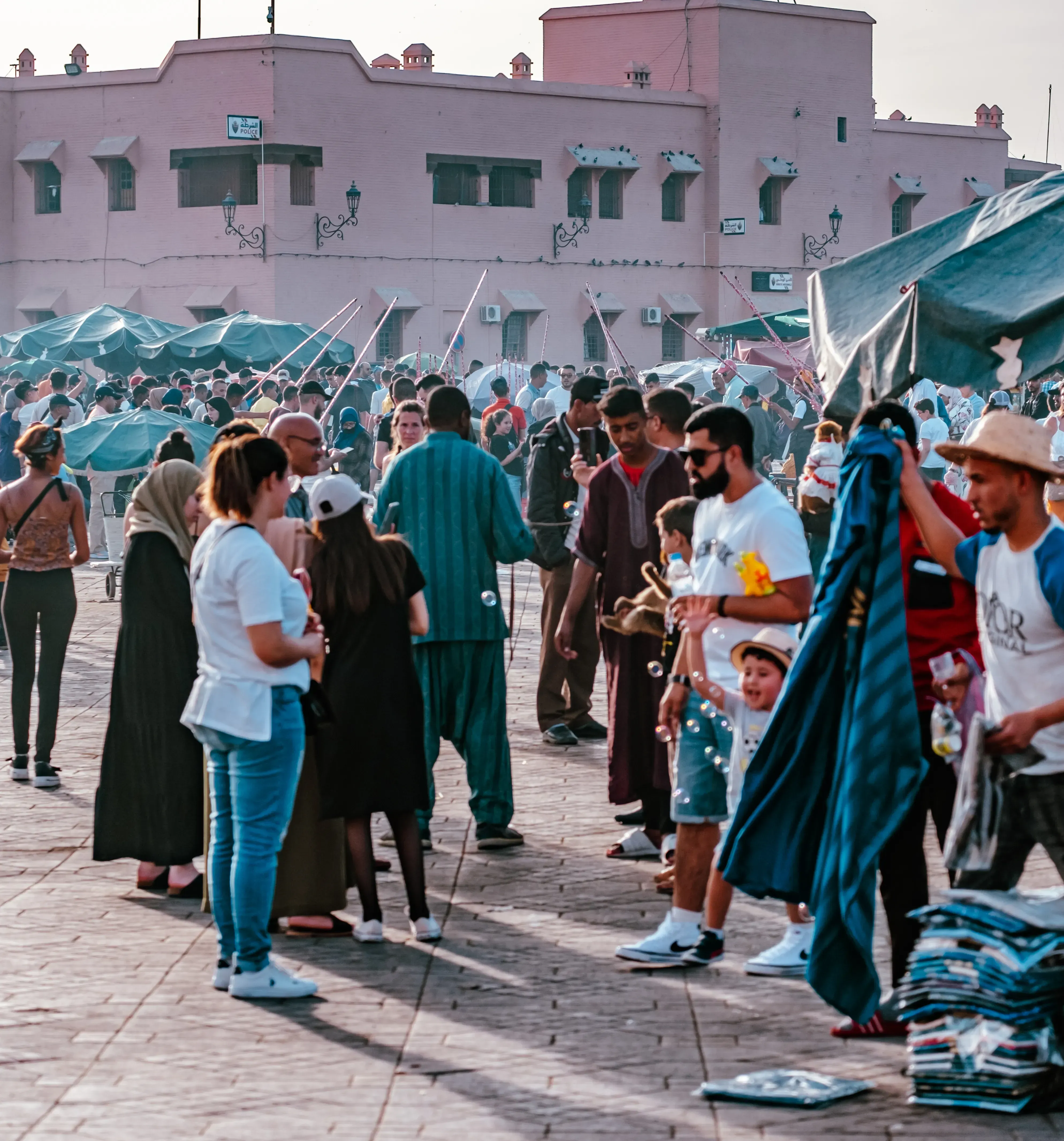 Overhead shot of the crowded Jemaa el-Fna main square at its peak activity.