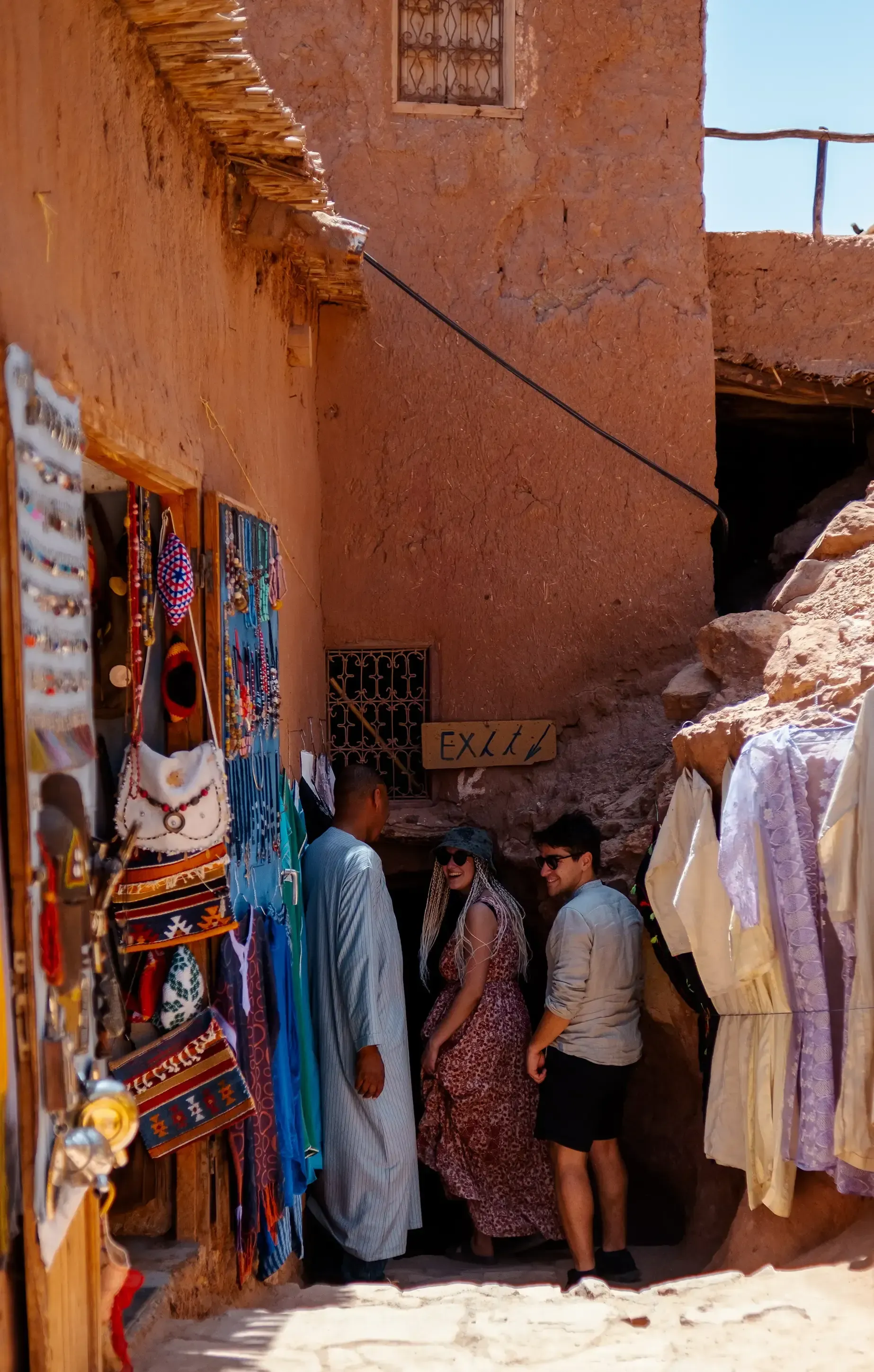 Ieser and Letizia walking with a local guide through the Moroccan landscape.