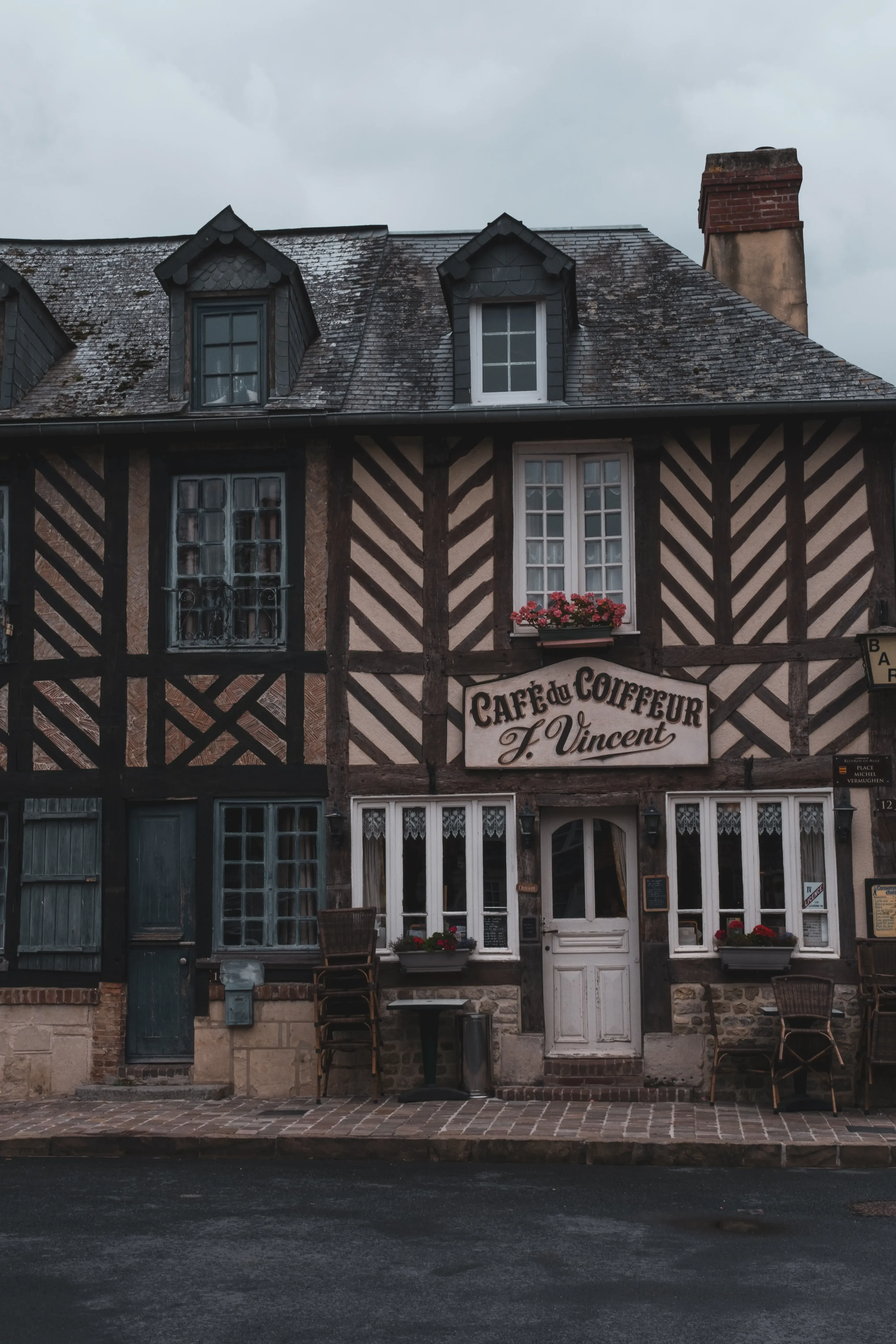 A traditional Norman half-timbered house located along the scenic Cider Route (Route du Cidre).