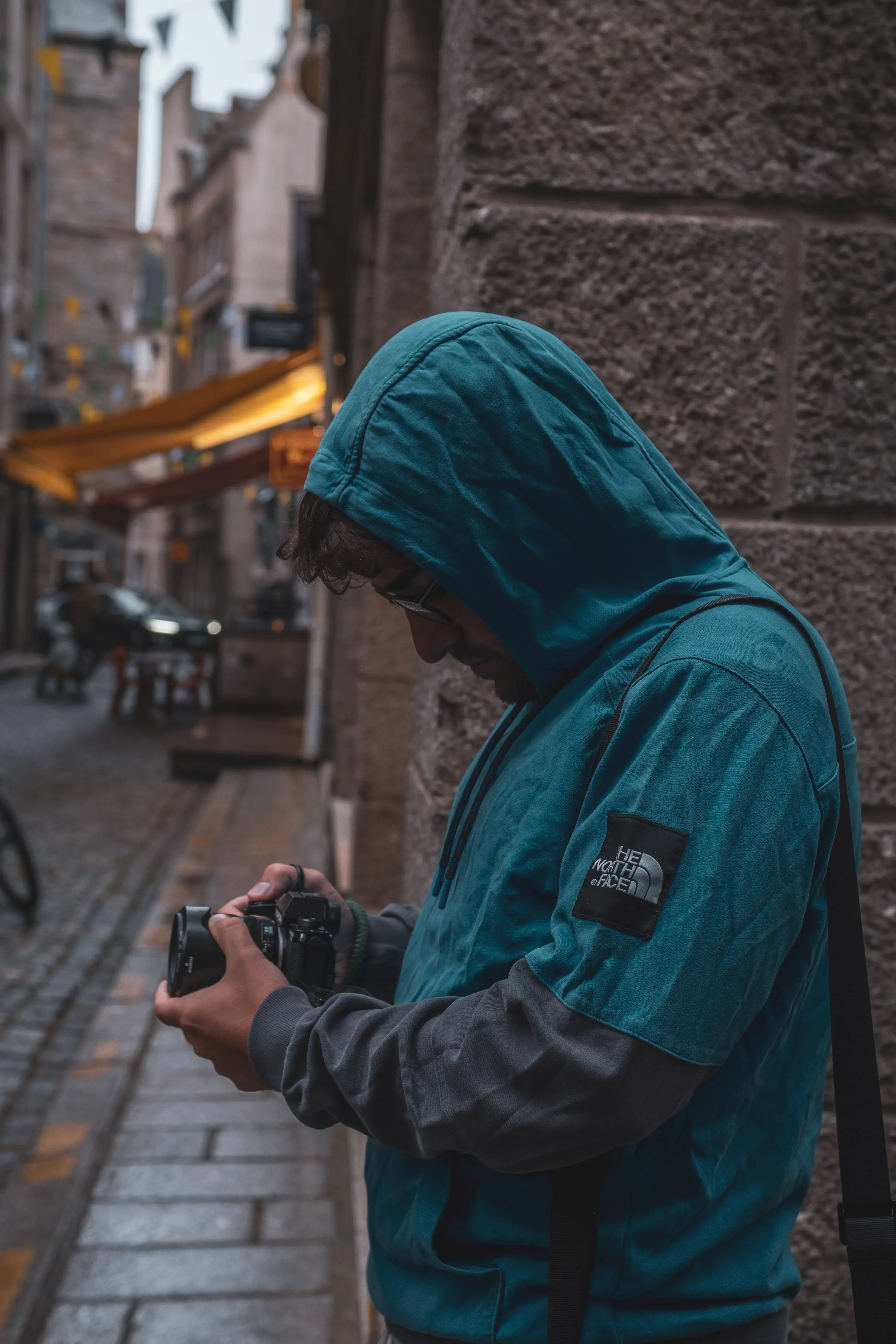 Ieser taking a photograph within the walled city (Intra-Muros) or on the ramparts of Saint-Malo.