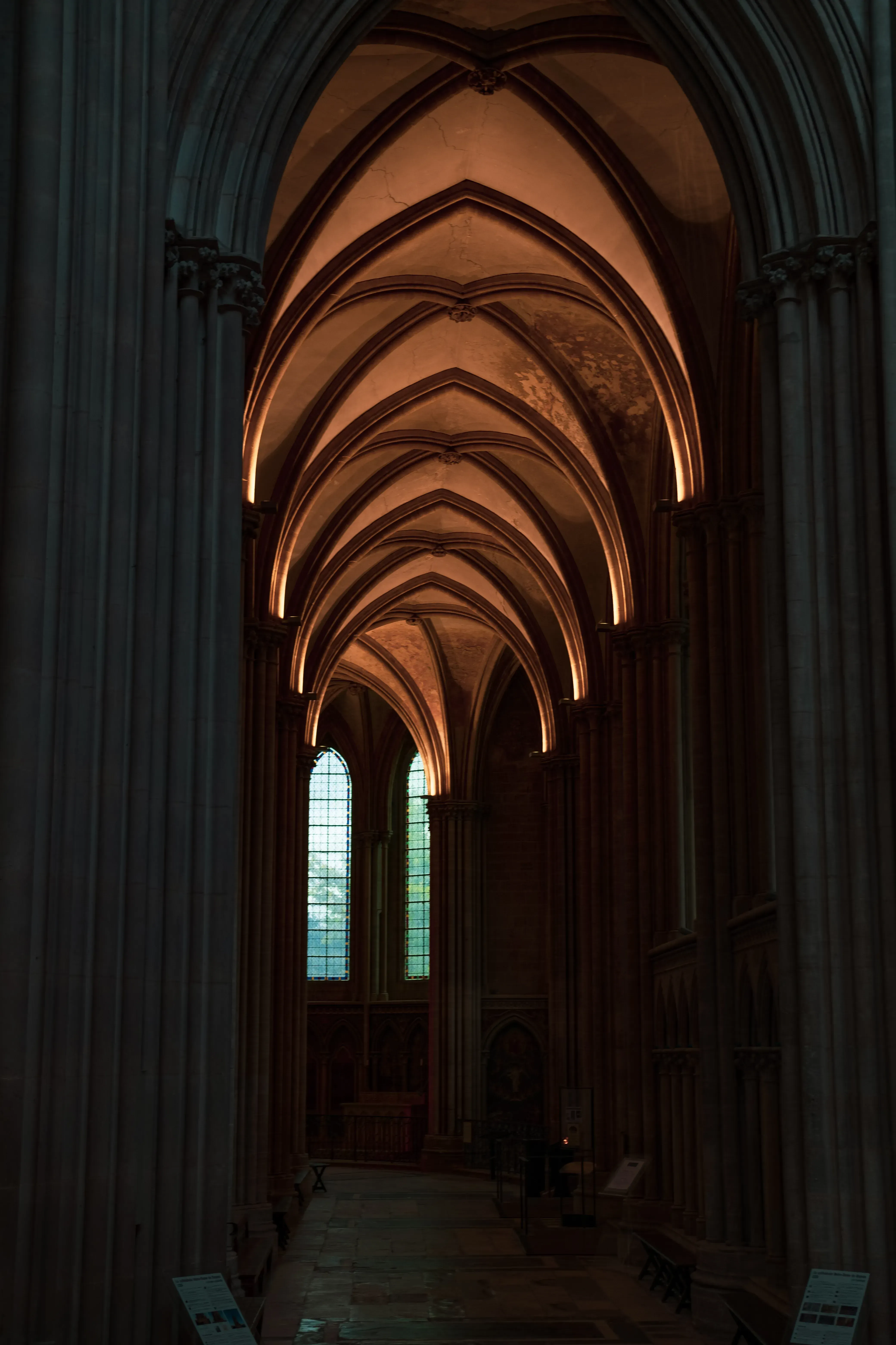 A long, arched stone hallway or corridor within the Abbey complex of Mont Saint-Michel.