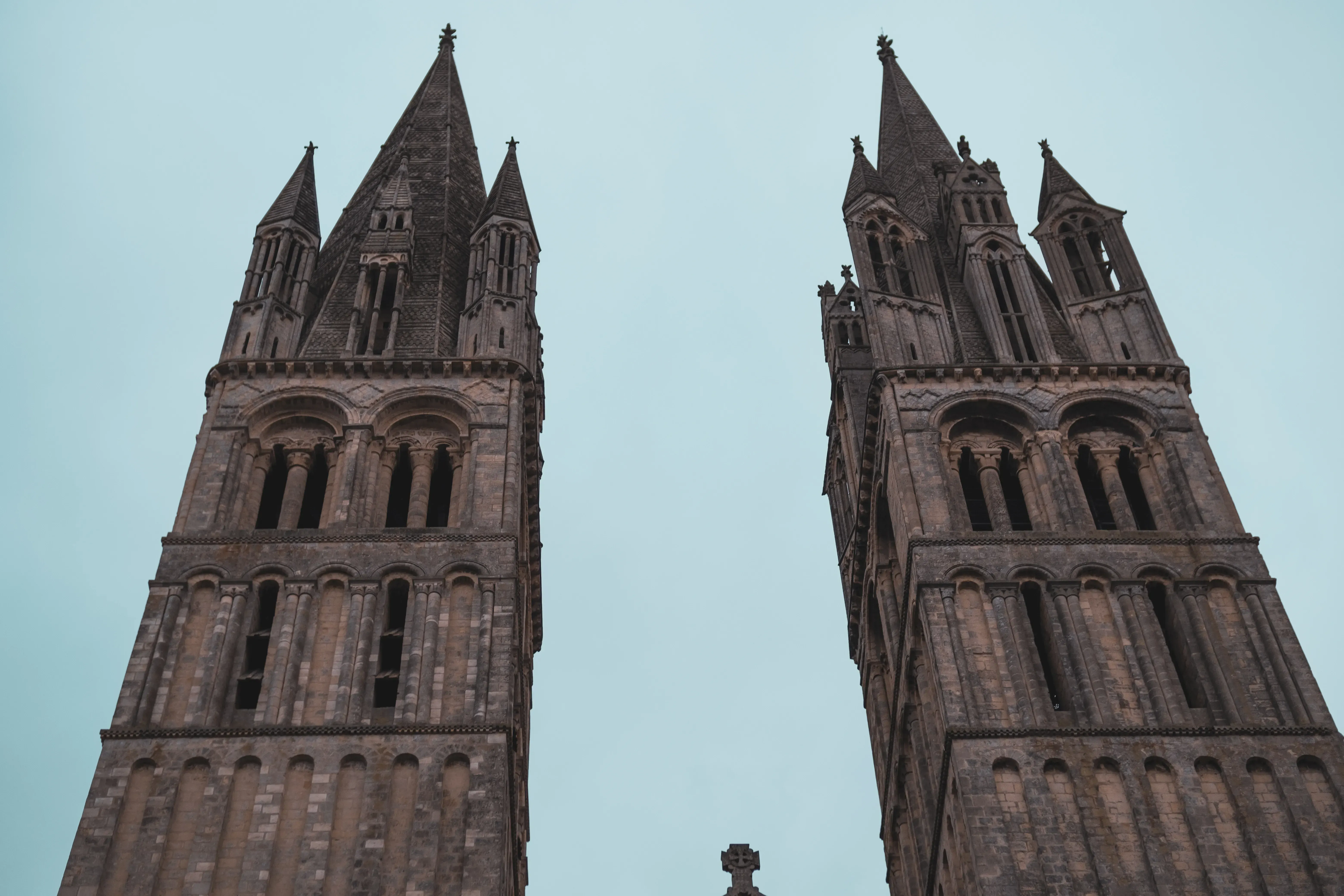 The imposing, ruined stone towers and bell towers of Jumièges Abbey.