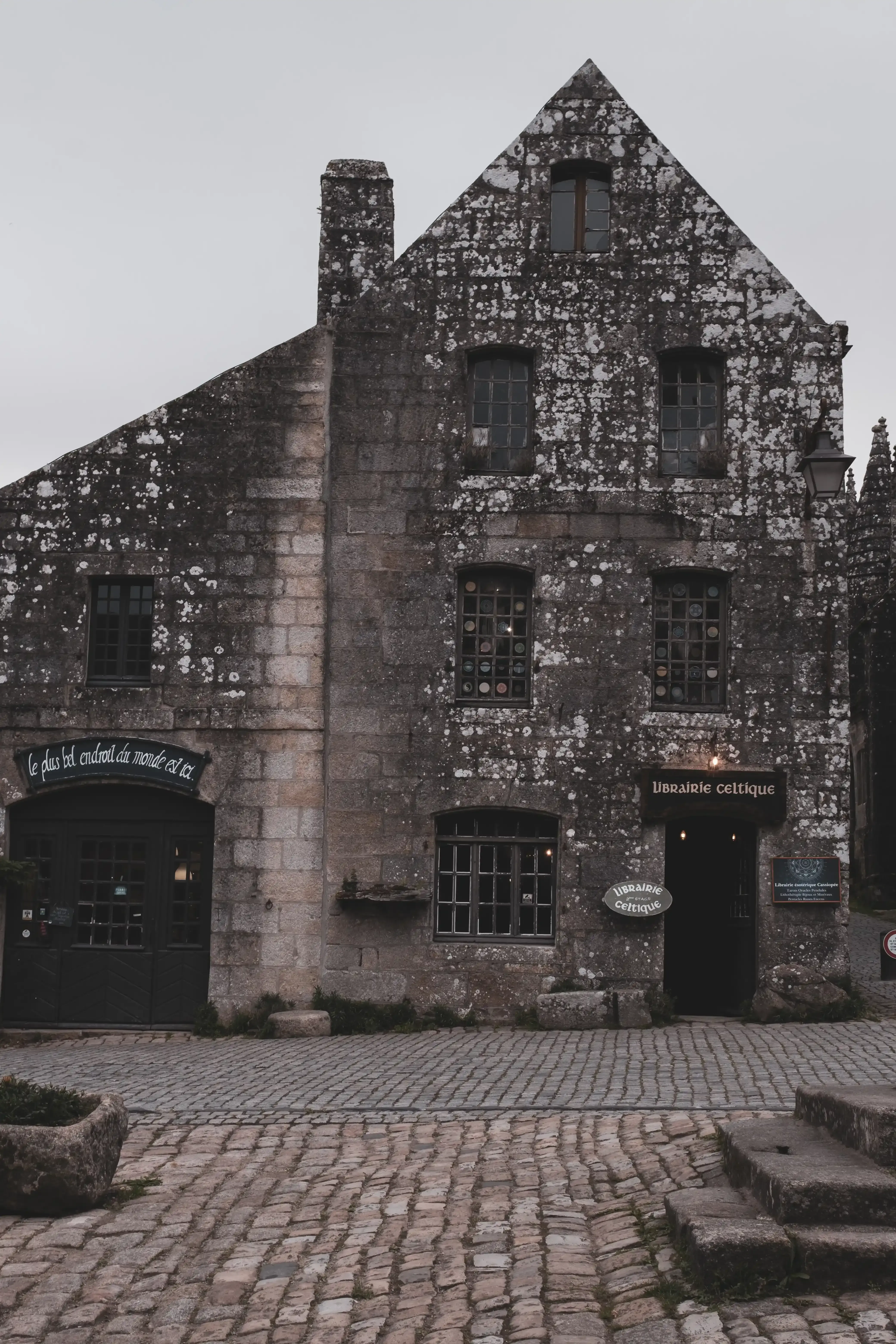 A storefront of a shop lining the stone streets of the historic village of Locronan.