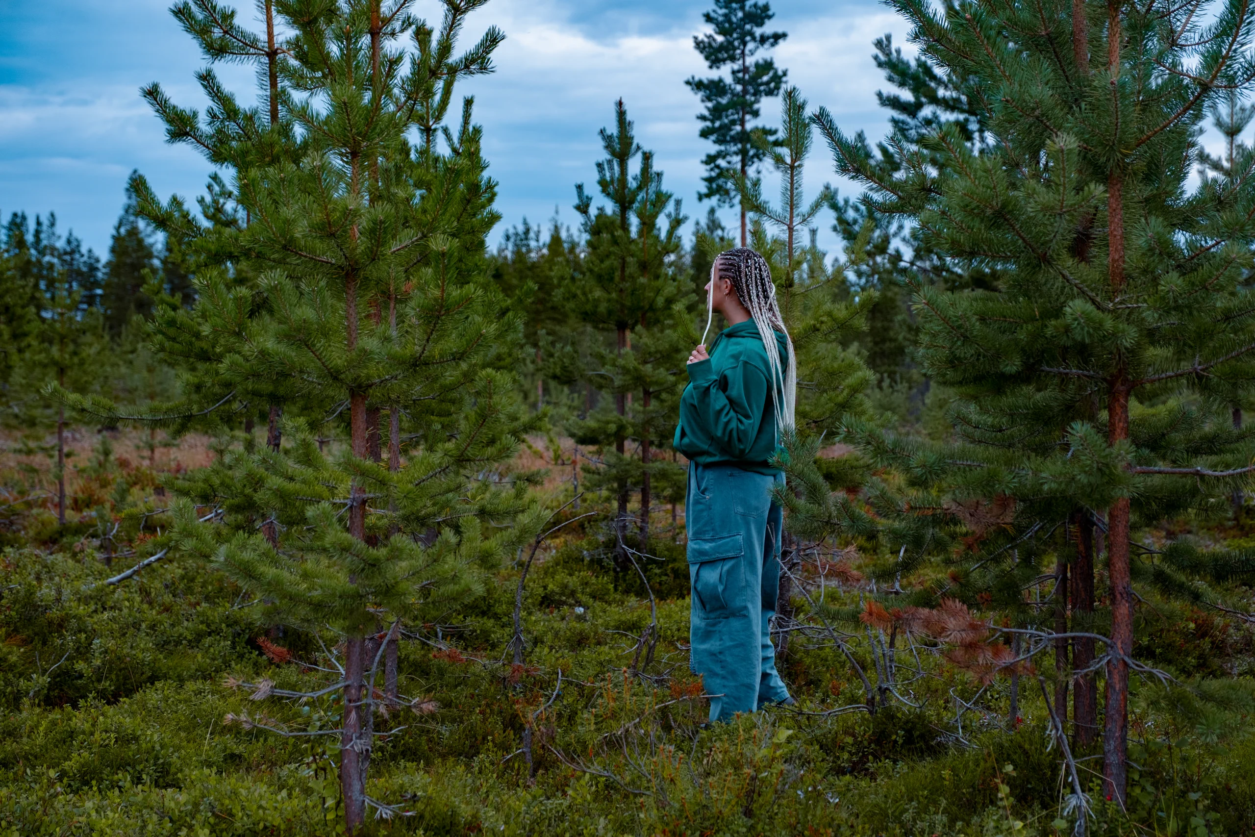 Letizia exploring a dense Swedish forest while searching for reindeer.