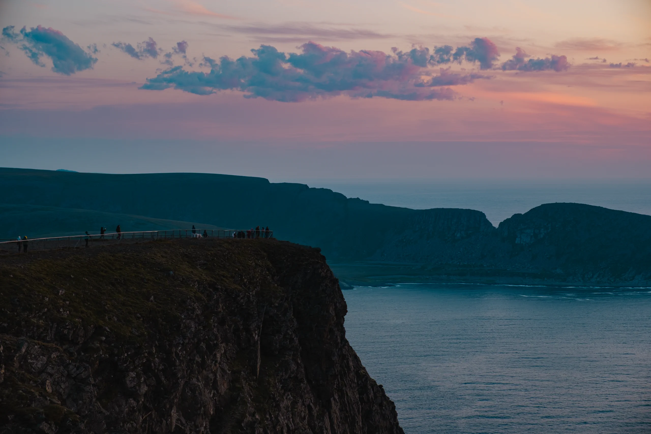 View of the sheer, dramatic sea cliffs near the North Cape plateau.