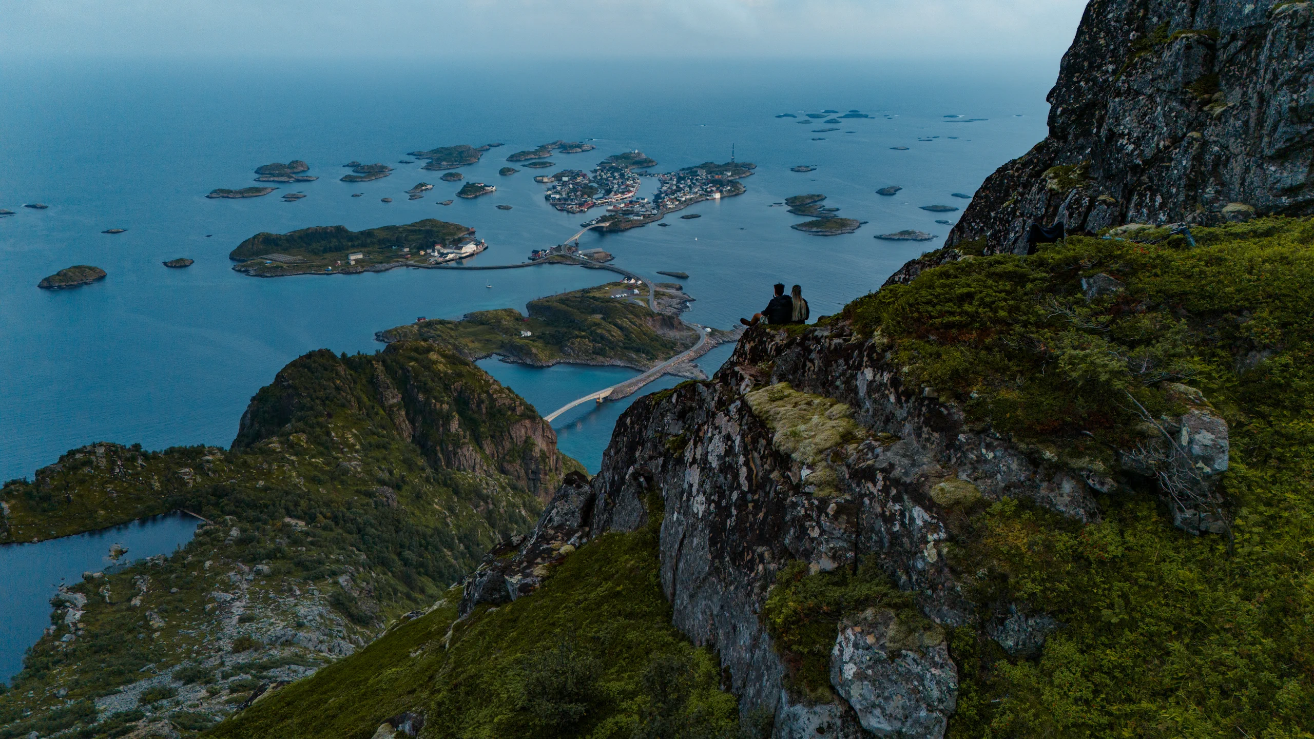 High-angle view looking straight down at the steep terrain from a Lofoten mountaintop.