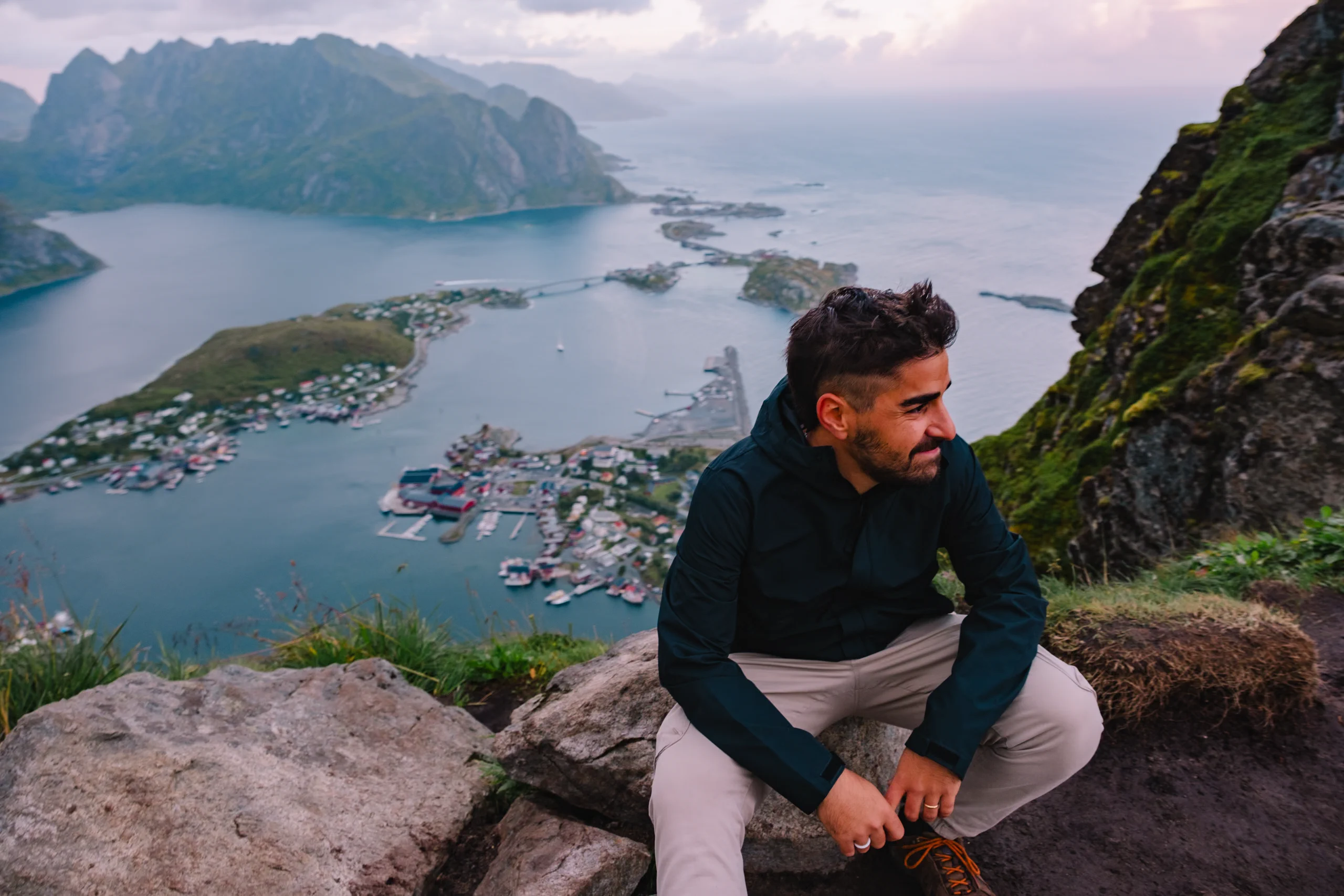 Ieser standing at the top of the Reinebringen steps overlooking the spectacular Lofoten panorama
