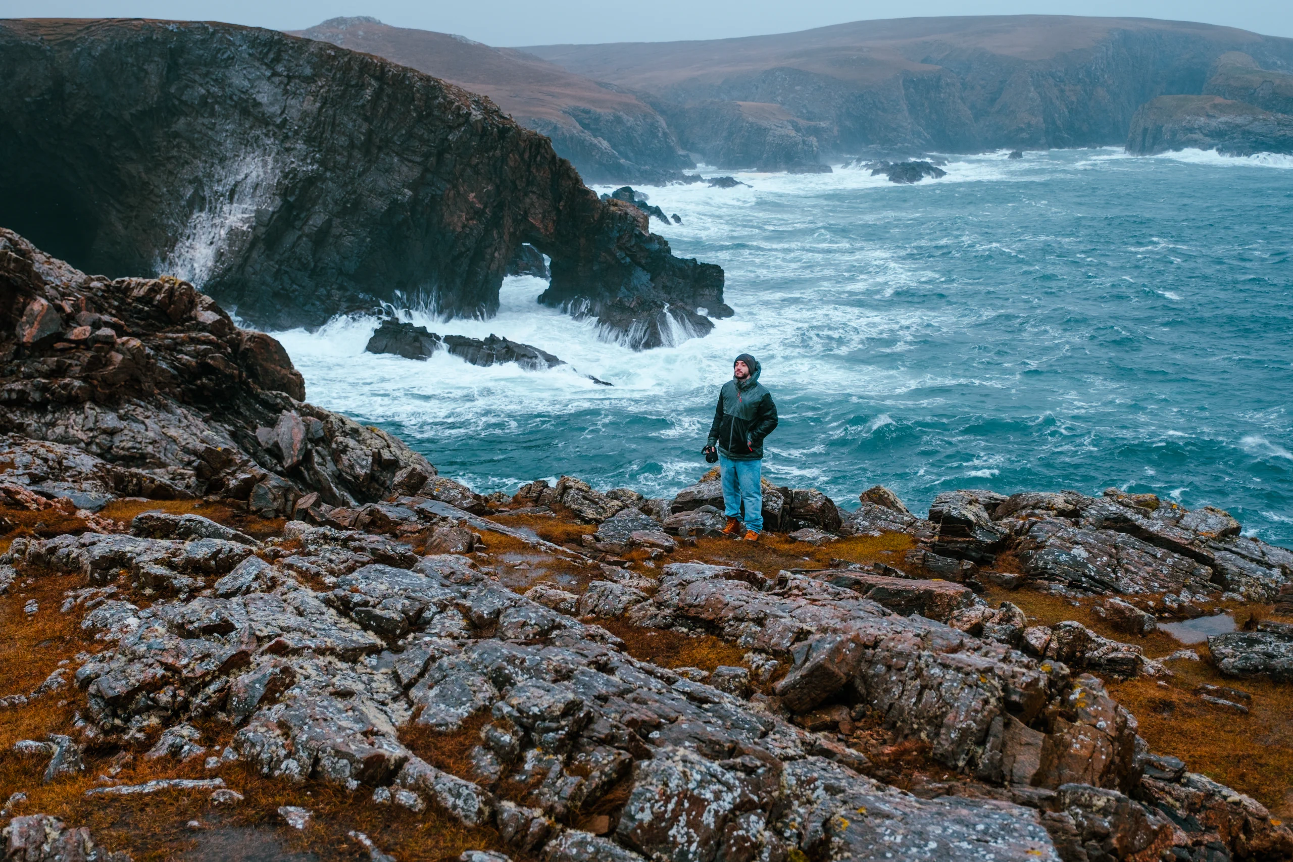 Stefano standing next to a Scotthis cliff