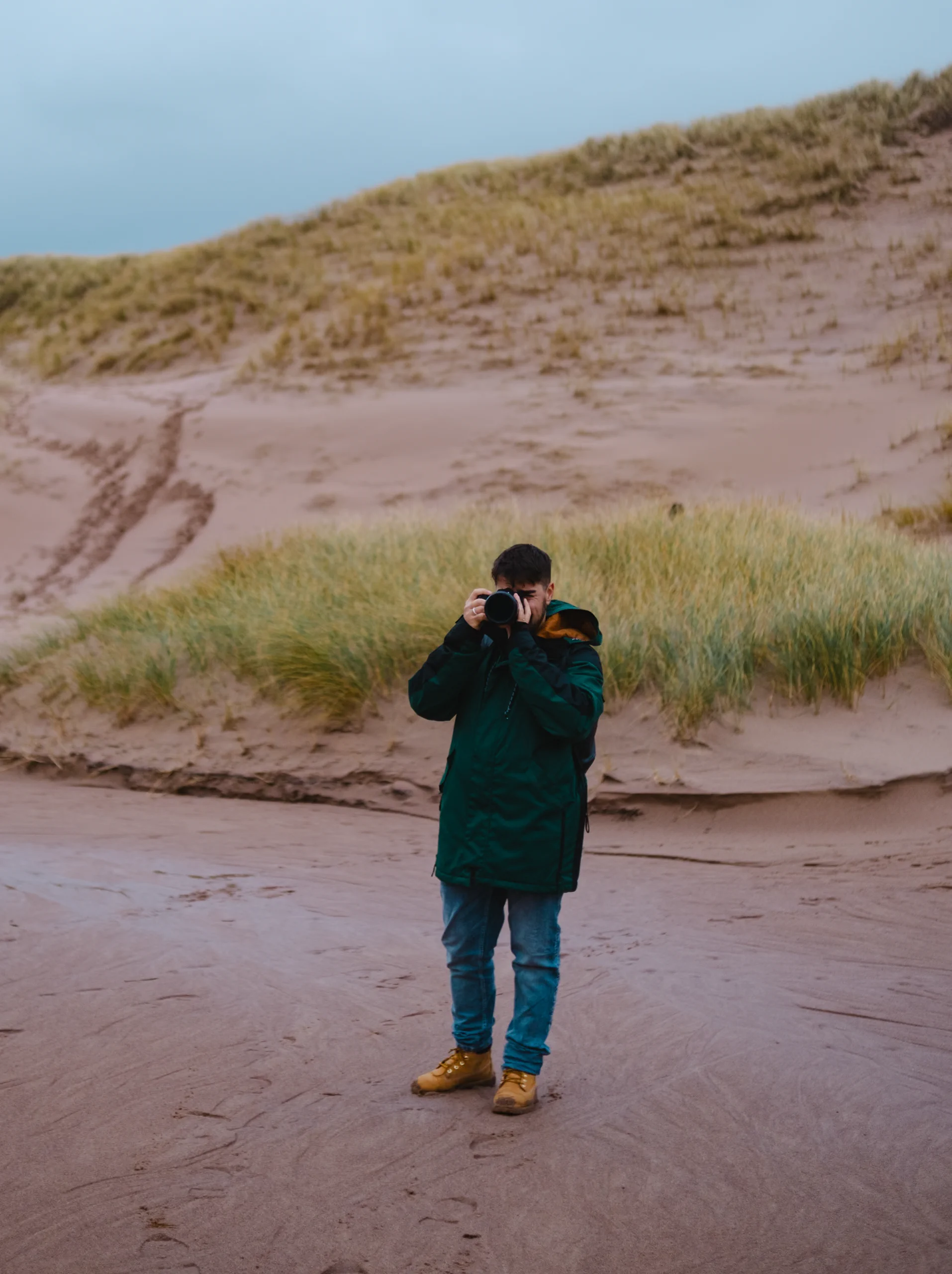 Ieser taking a picture on the beach